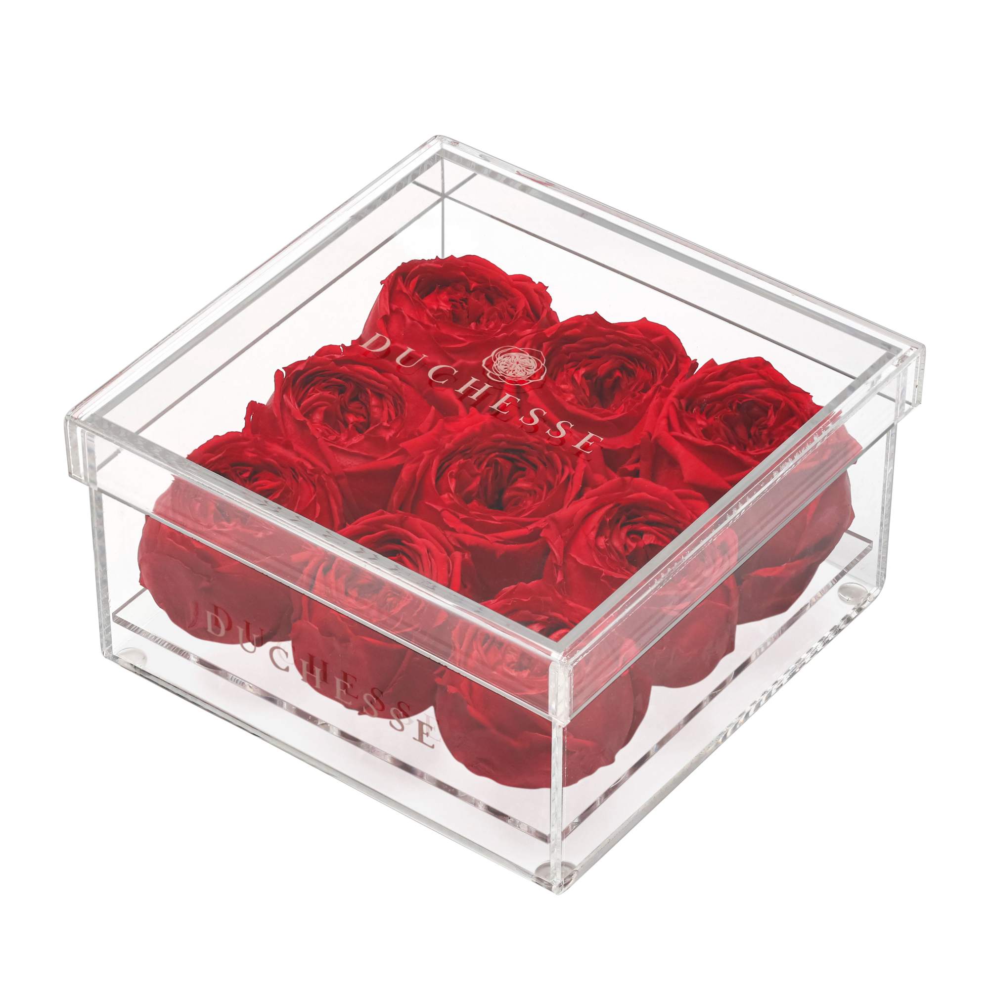 Red roses in a clear square acrylic box