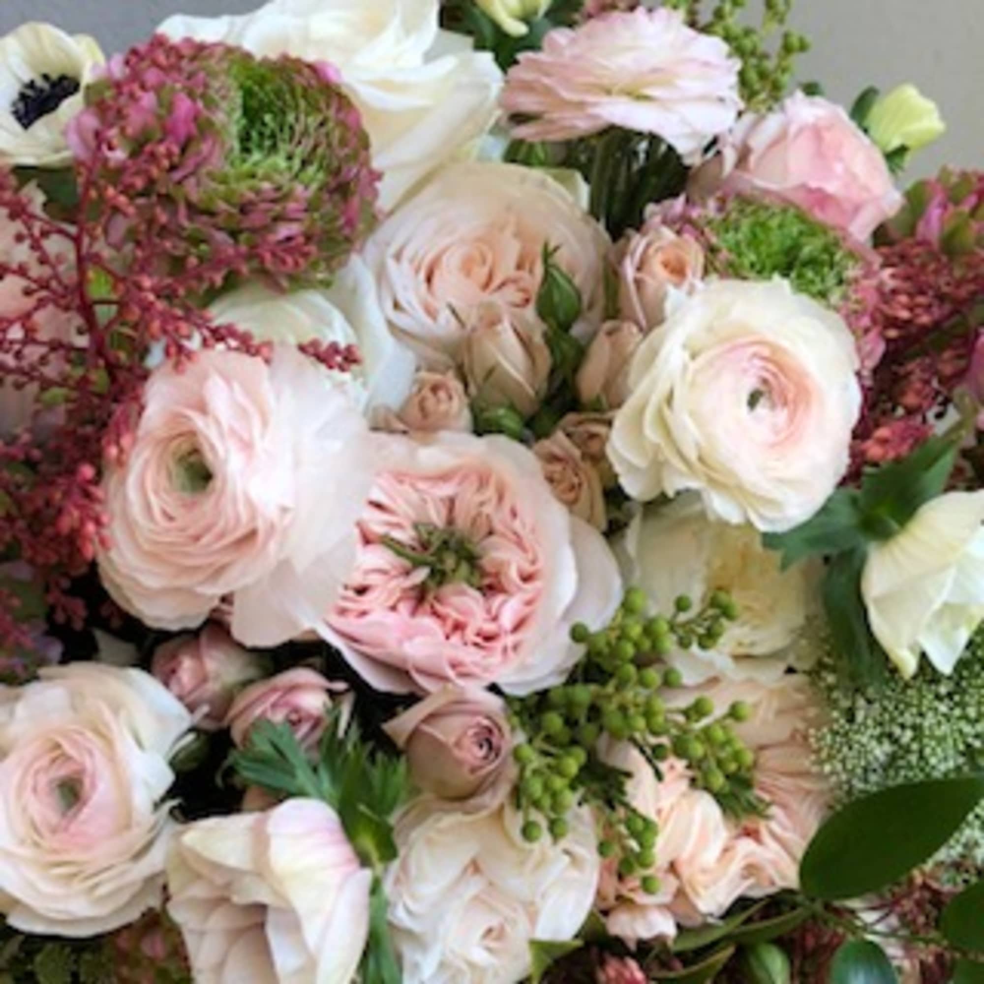 Bouquet of pale pink and white flowers with green accents, photo 2 of 2