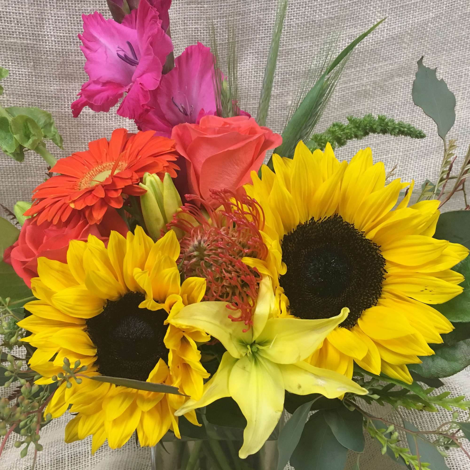 Bright mixed bouquet with sunflowers, roses, and gerbera daisies