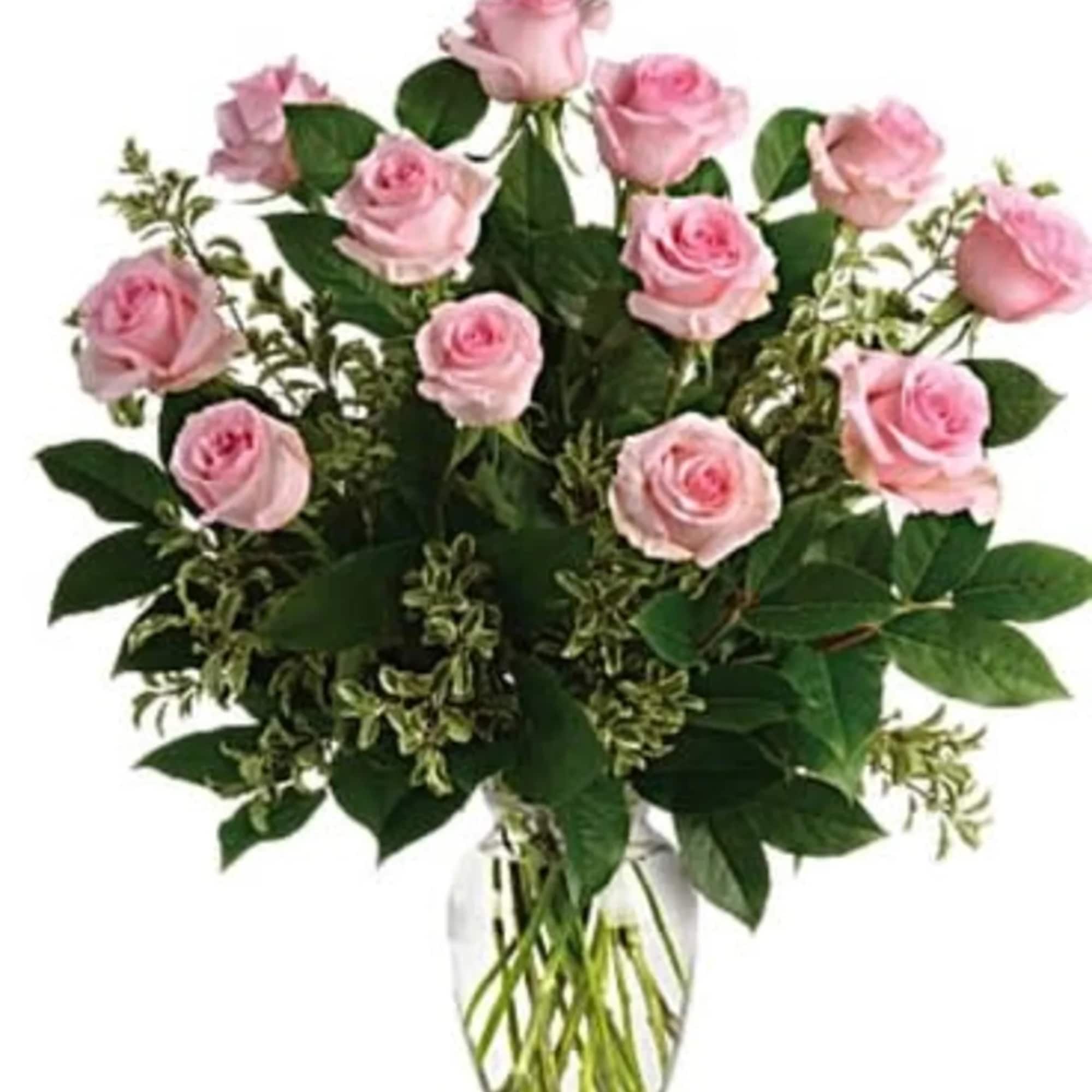 Pink roses arranged in a clear glass vase