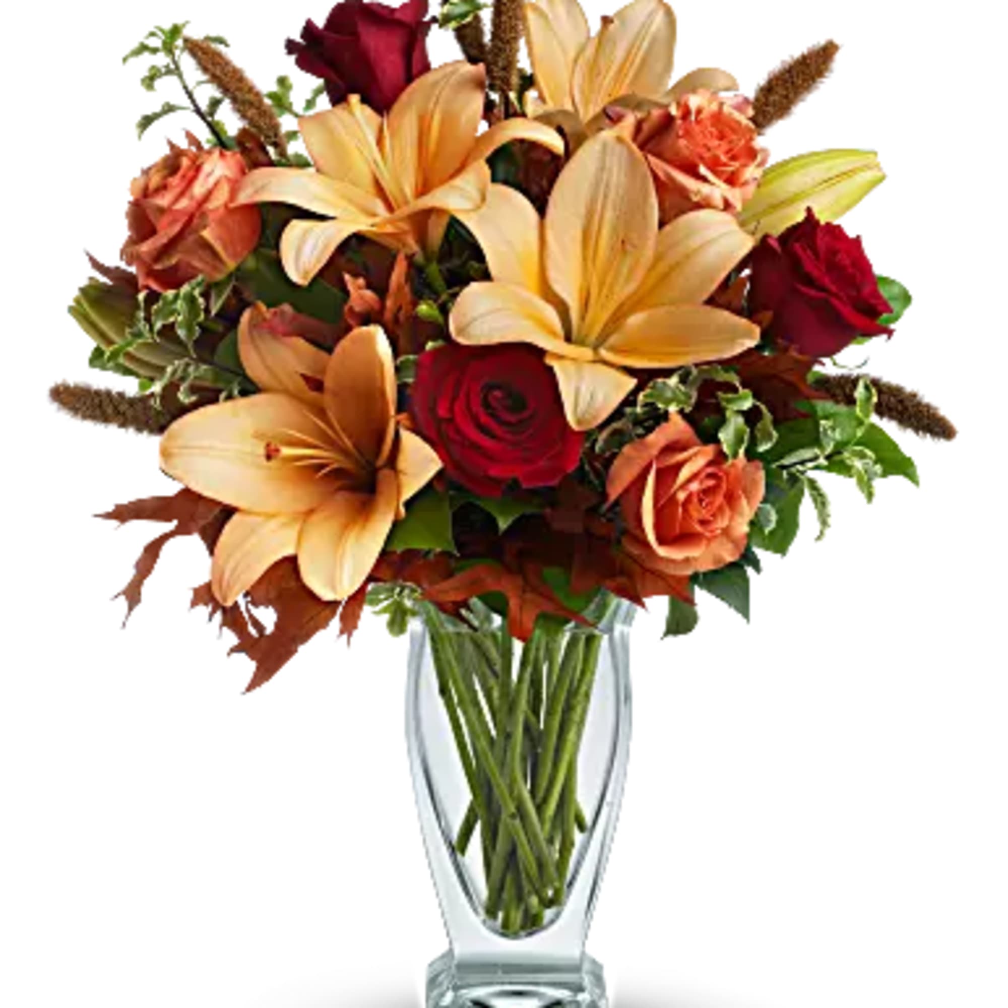 Roses, lilies and oak leaves create a fantasy of fall flowers. Send