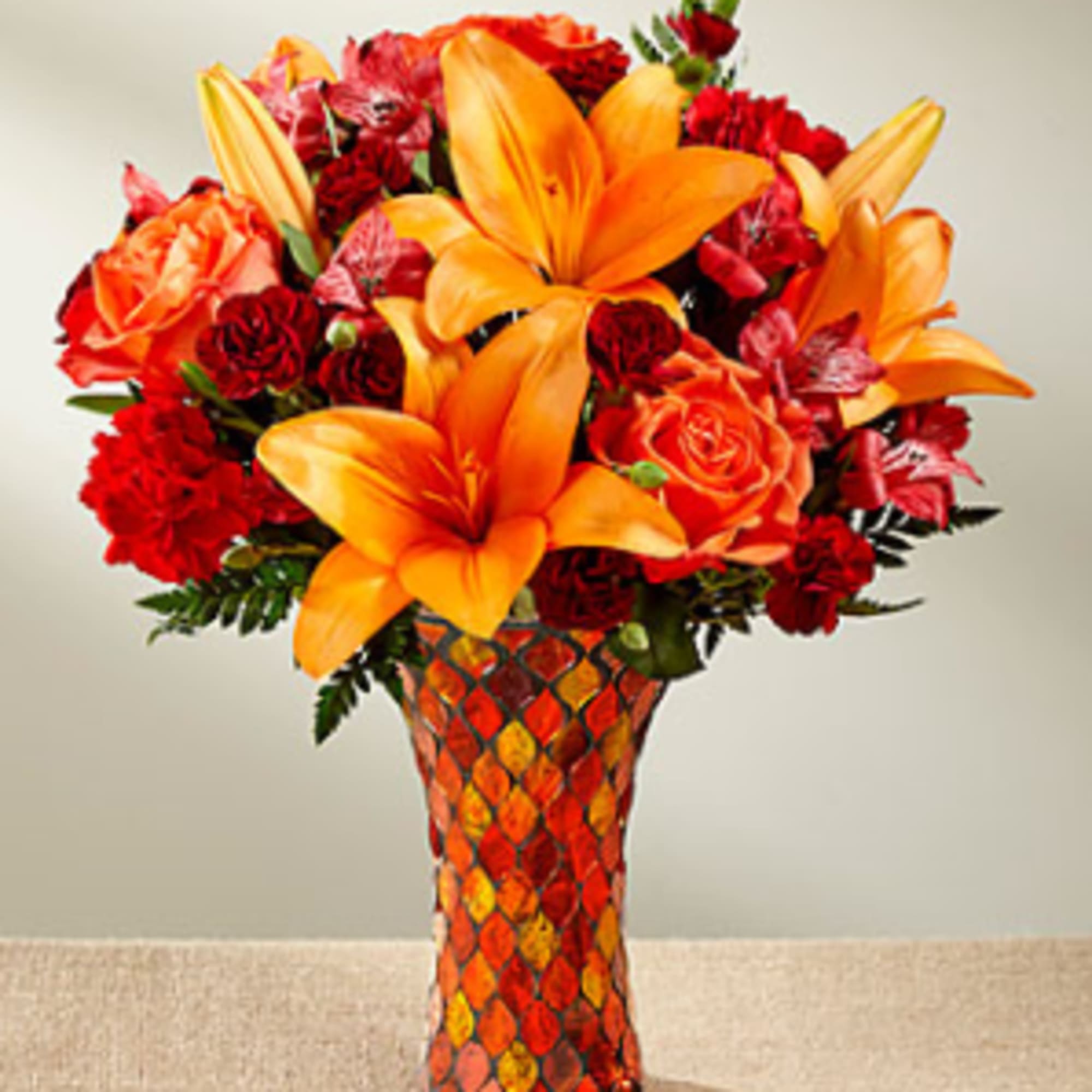 Saturated in the alluring hues of the harvest season, this fresh flower