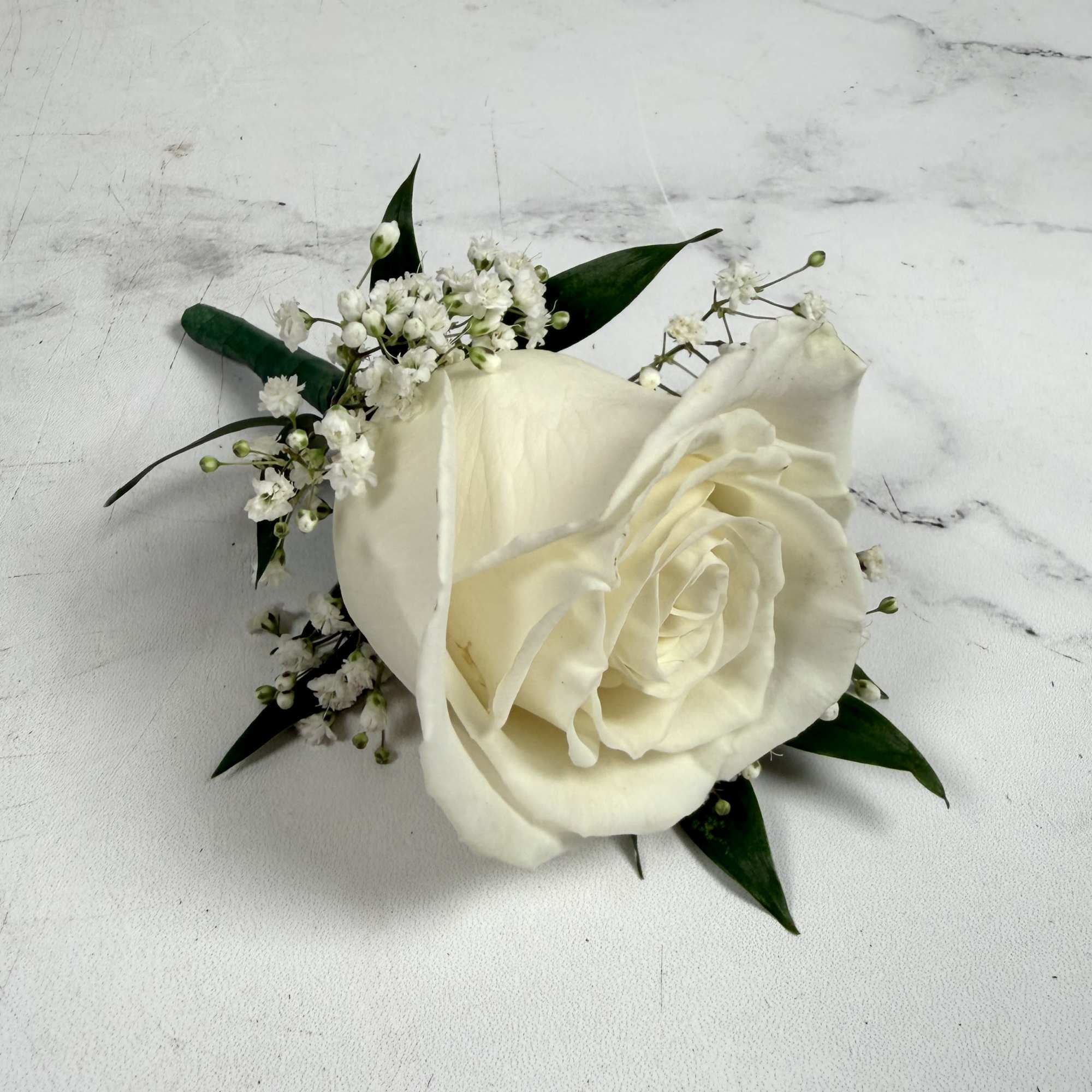 One white standard, full-sized rose with baby's breath makes up this classic, photo 2 of 3