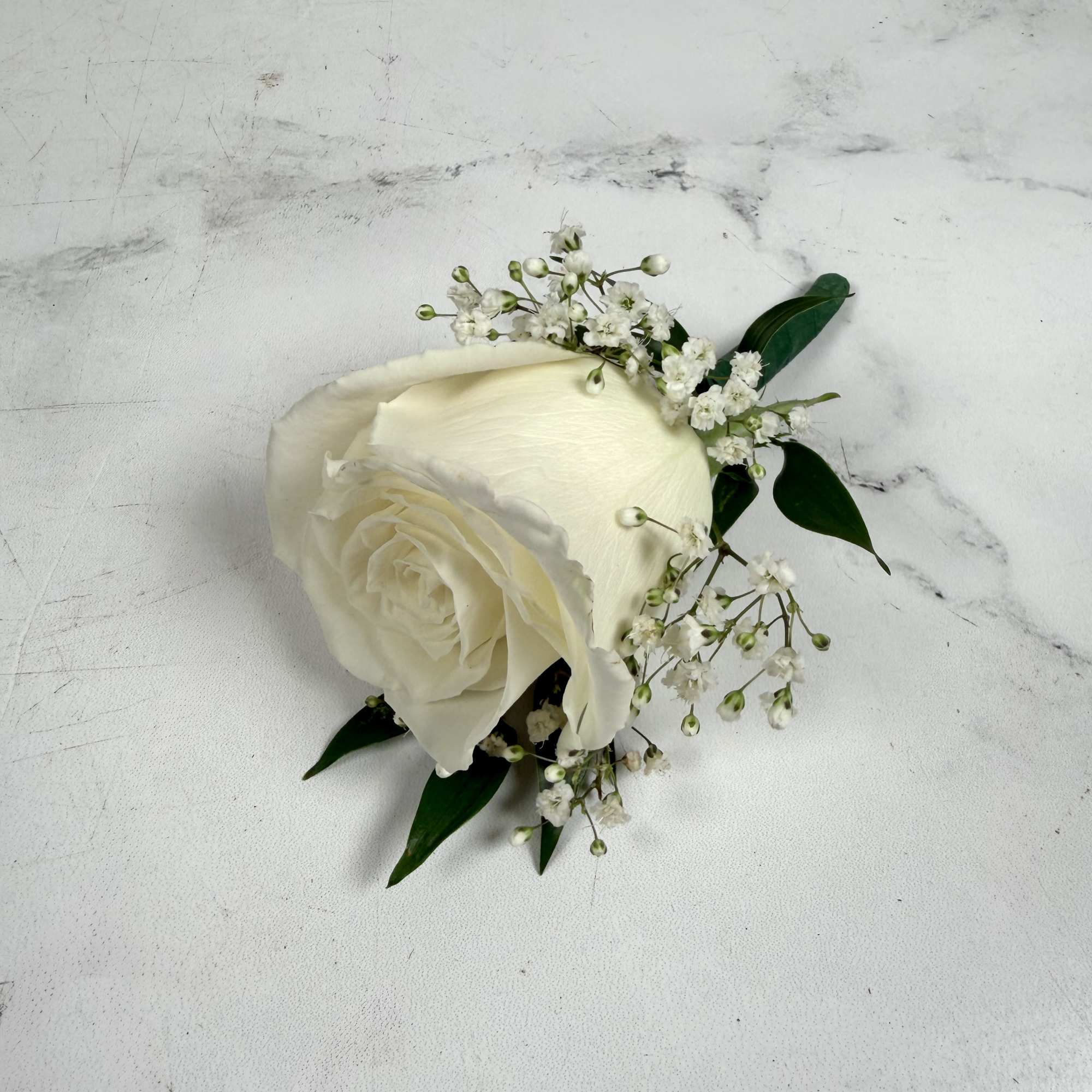 One white standard, full-sized rose with baby's breath makes up this classic, photo 3 of 3