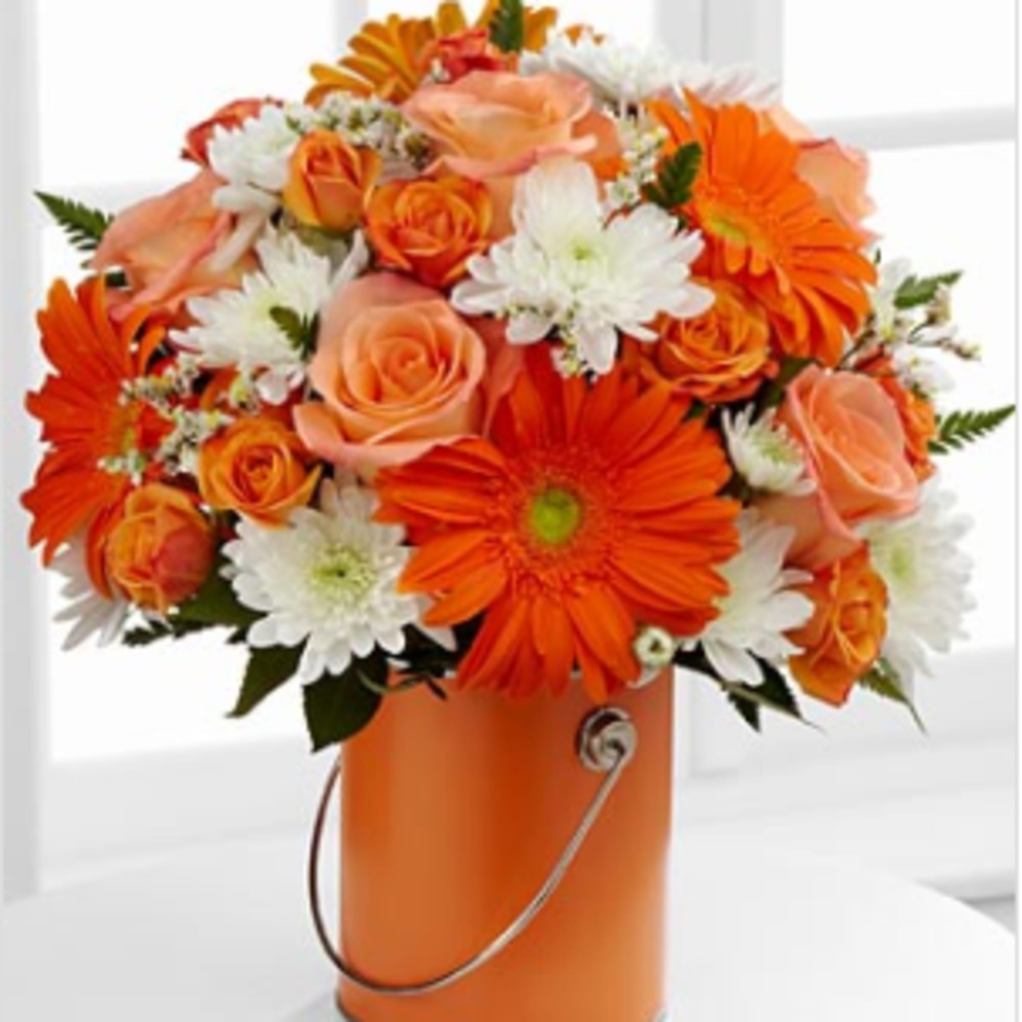 Perfect orange roses, orange gerbera daisies and orange spray roses pop against, photo 2 of 3