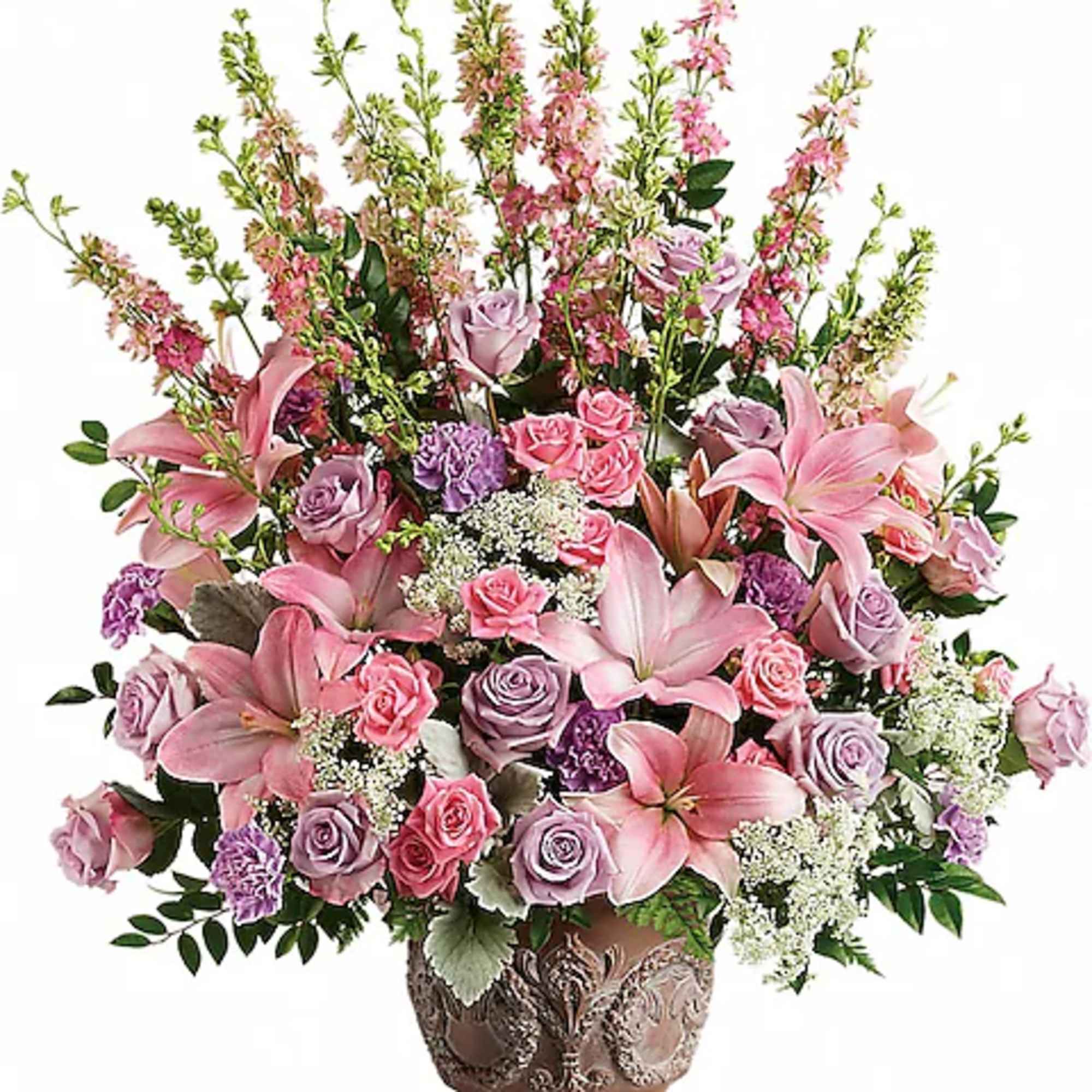 Pink and lavender roses with lilies in an ornate vase