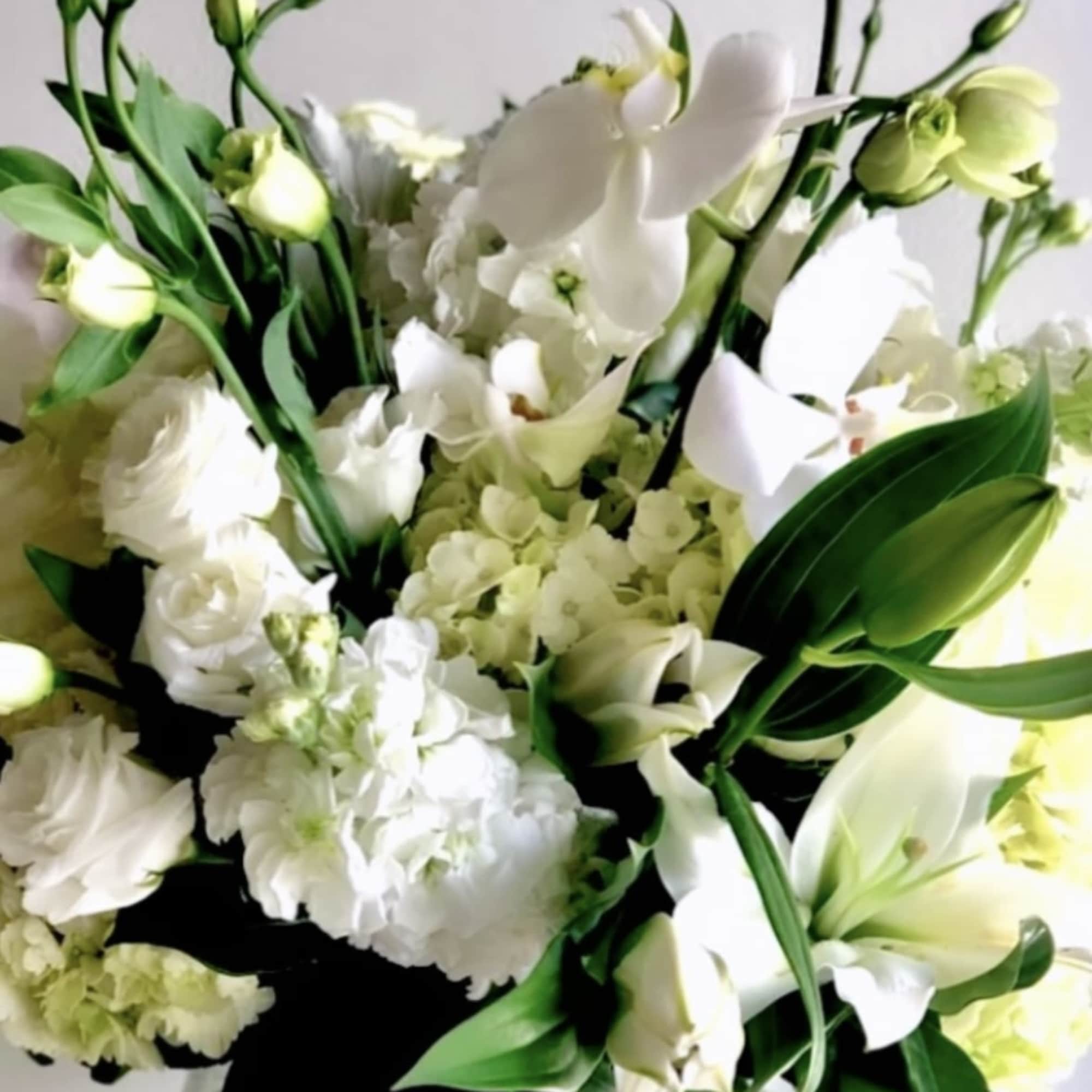 White floral bouquet in a clear glass vase, photo 2 of 2