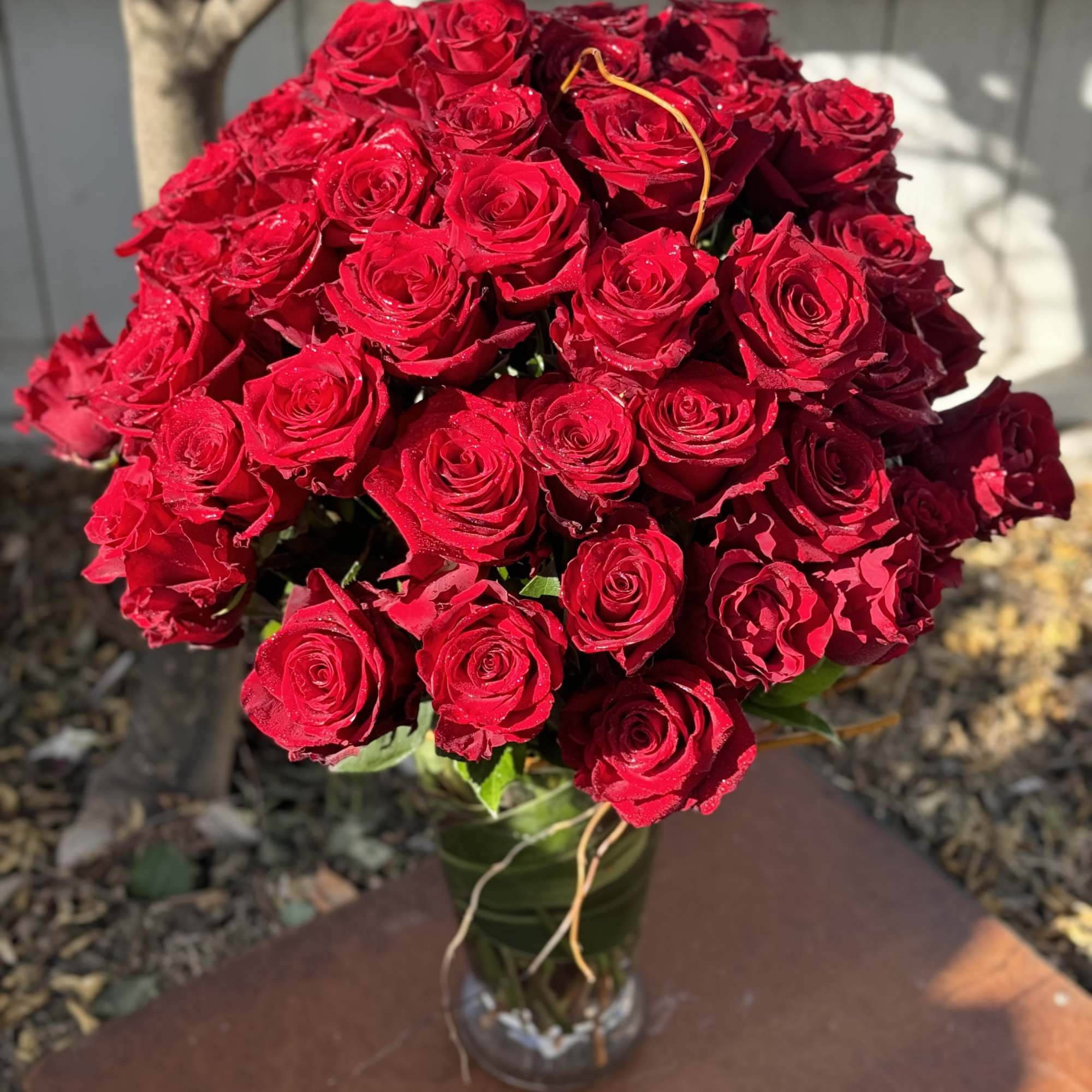 Bouquet of red roses in a glass vase