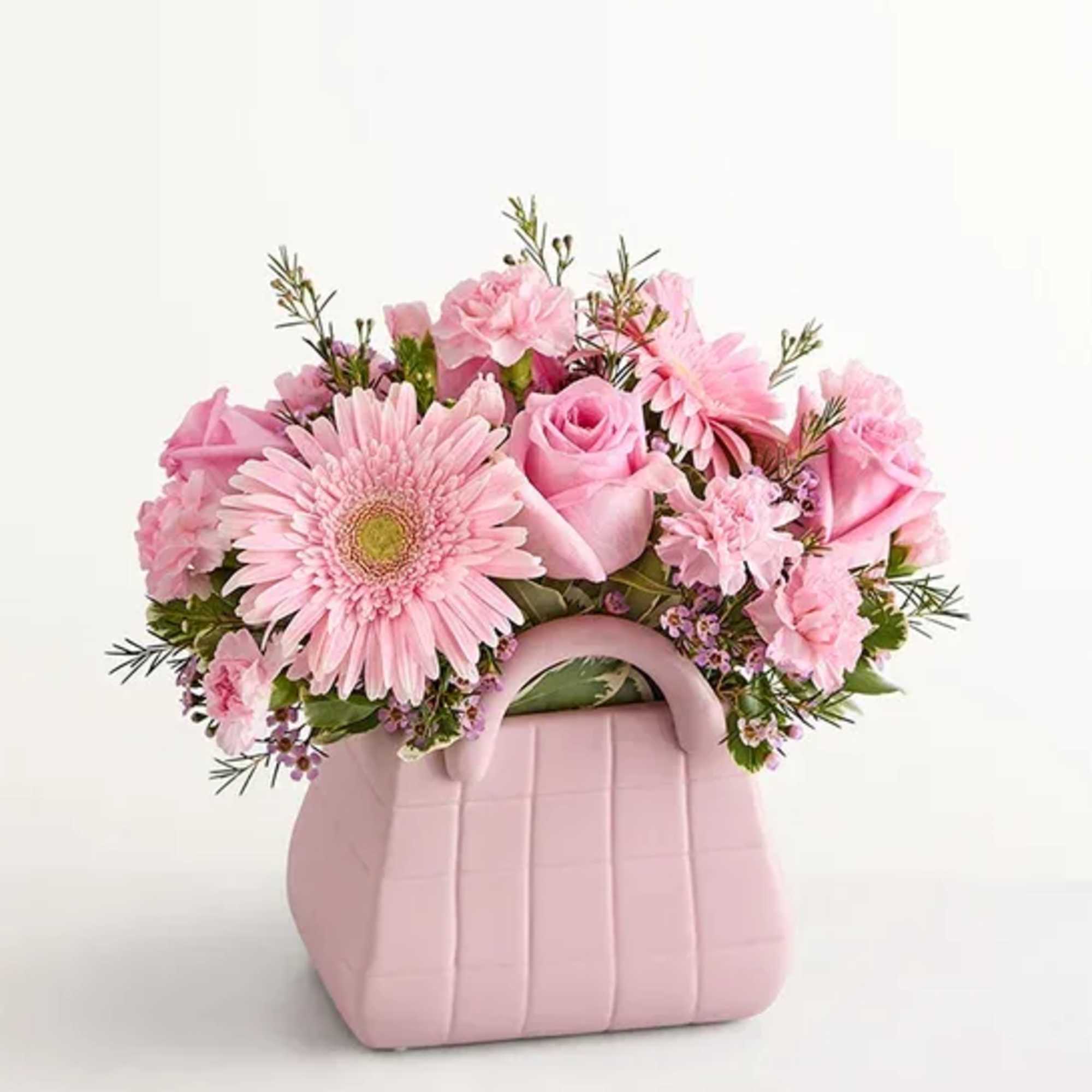 The ultimate arrangement for your favorite fashionista. Roses, Gerbera daisies, and other