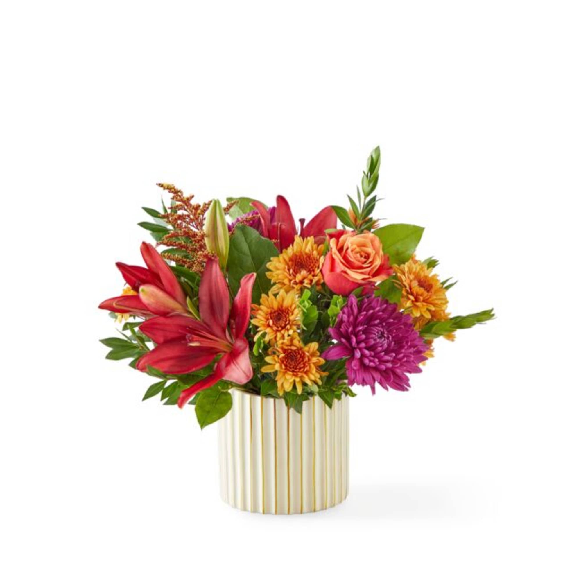 Colorful mixed bouquet in a striped gold vase