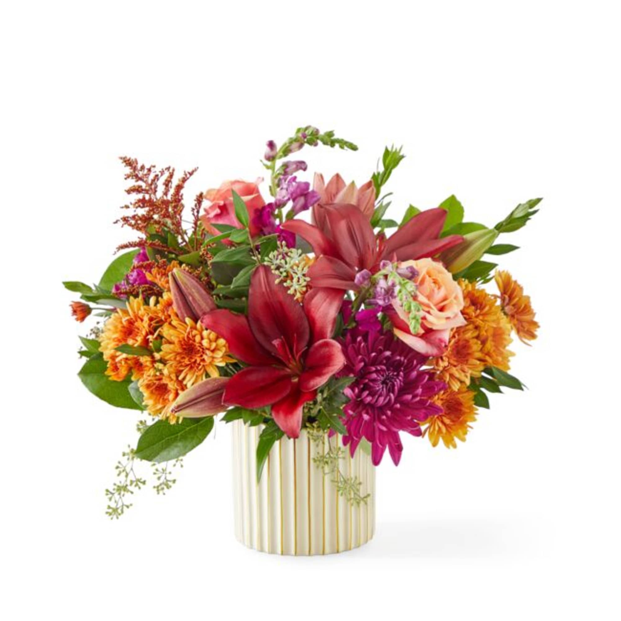 Colorful bouquet of lilies, roses, and chrysanthemums in a striped vase