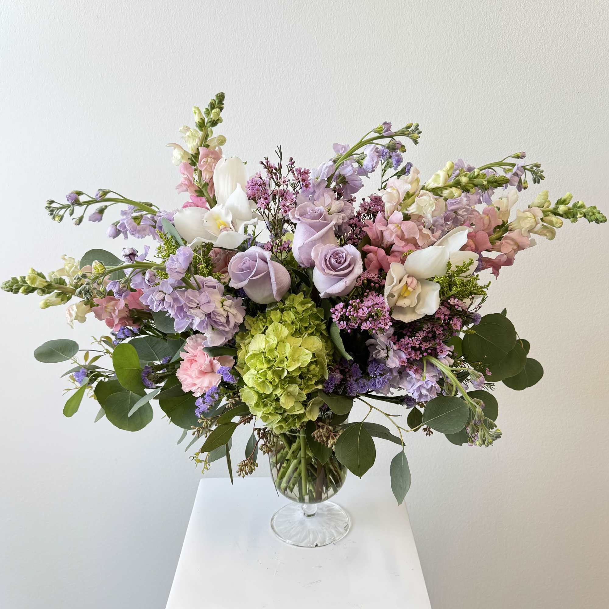 Mixed pastel bouquet in a clear glass vase