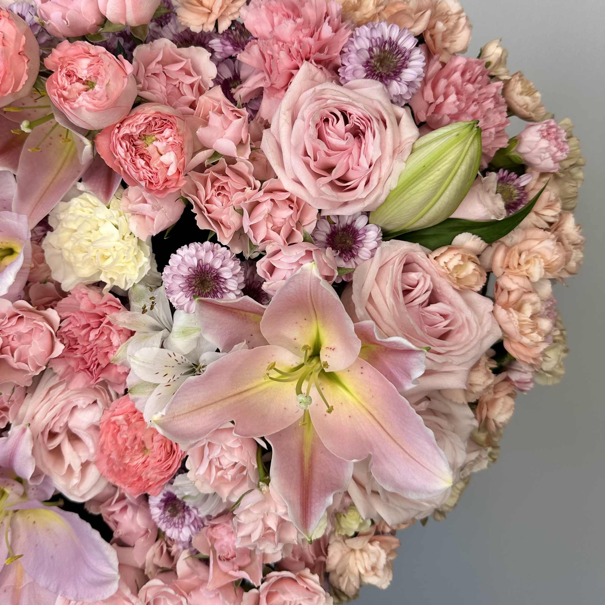 Pink bouquet with roses, lilies, and mixed pastel blooms