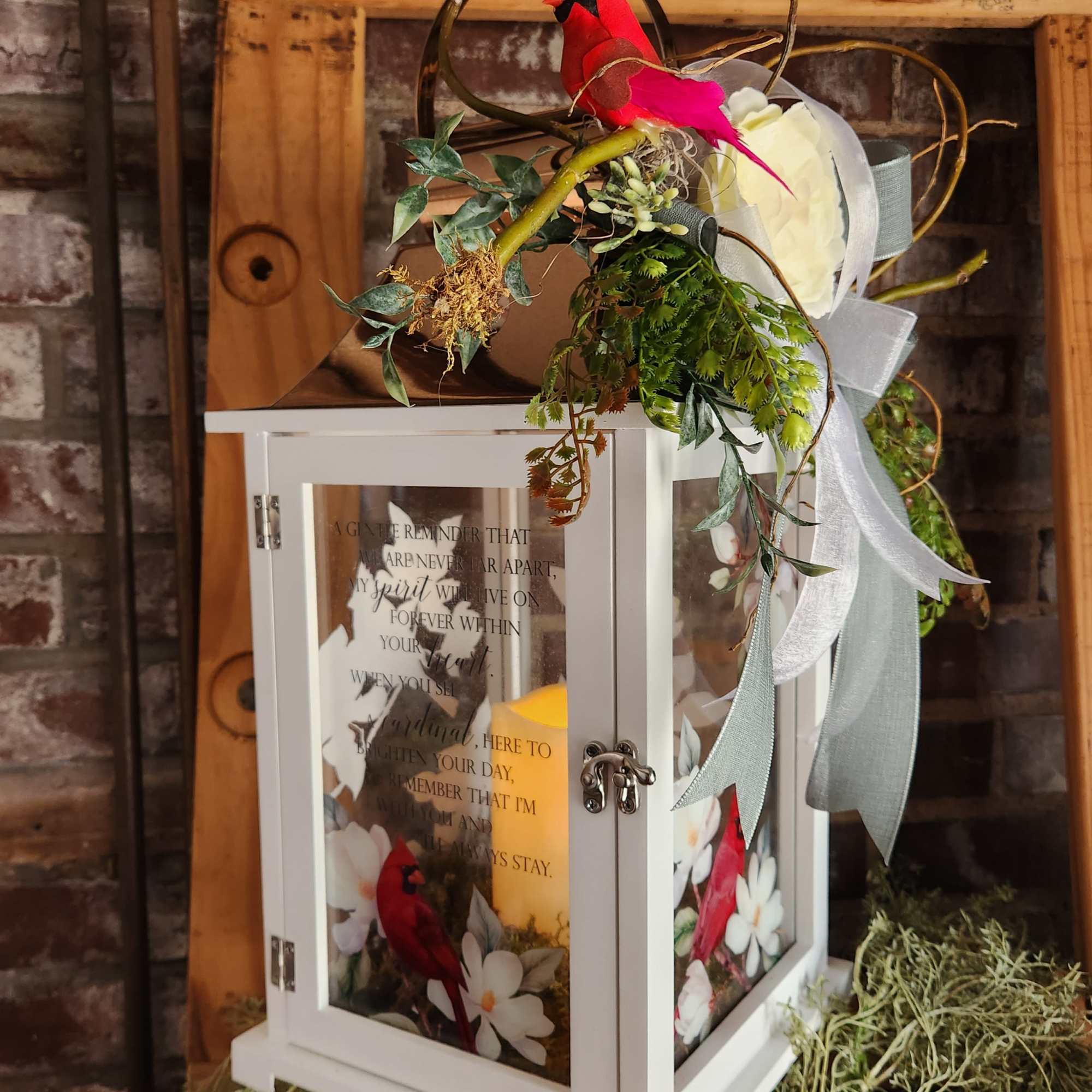White lantern with red bird decoration and ribbon accents