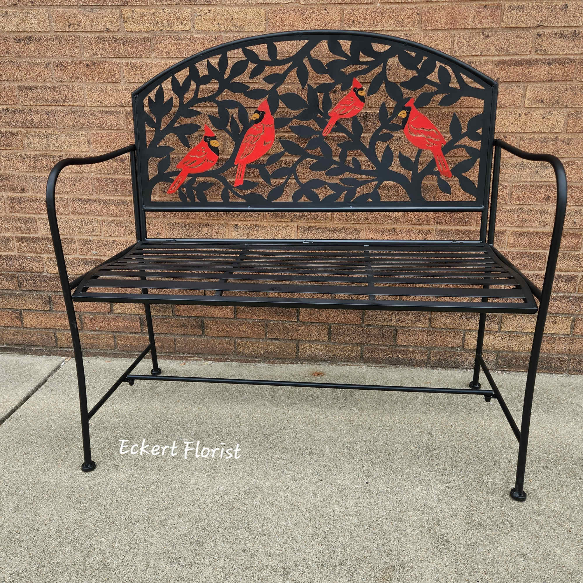 Black metal bench with red cardinal cutout backrest, photo 2 of 2