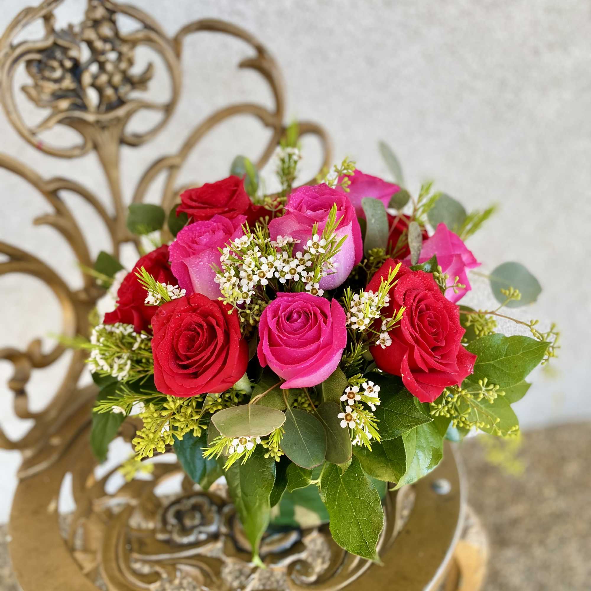 Hot pink and red roses compliment each other beautifully in this design.