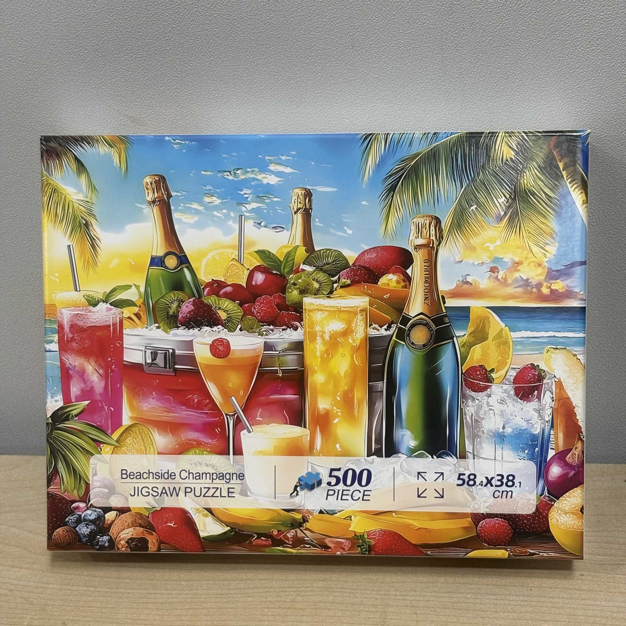 Box of a beachside champagne jigsaw puzzle with tropical drinks and fruit