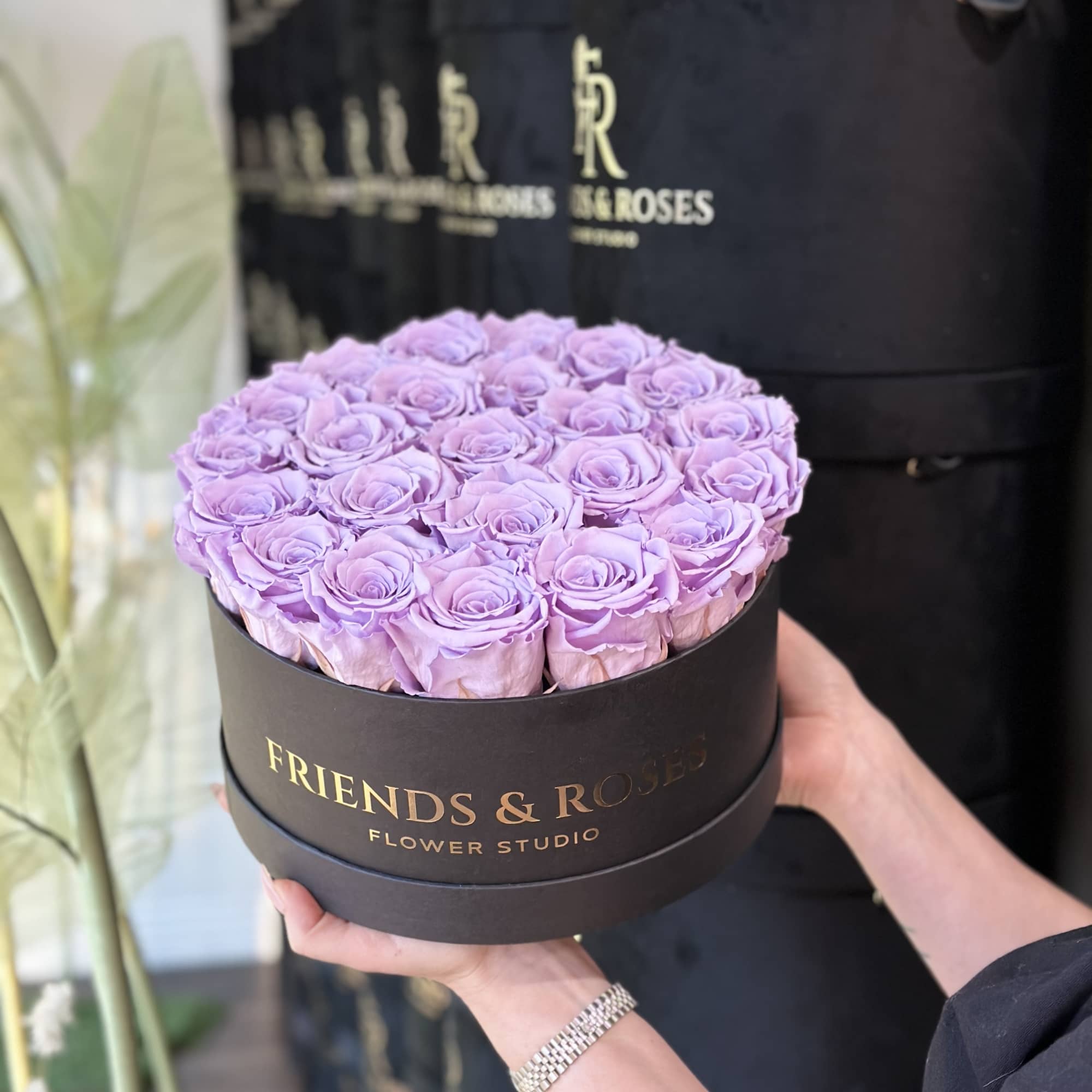 Lavender roses arranged in a round black box, photo 3 of 3