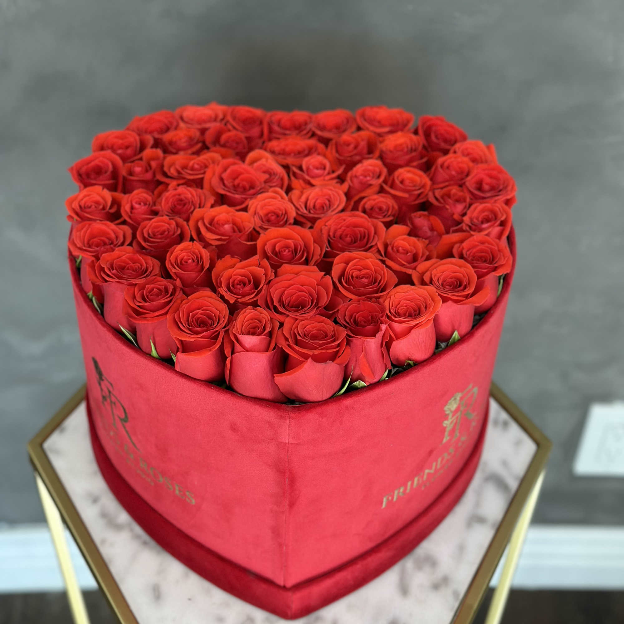 Heart-shaped box filled with red roses, photo 2 of 4