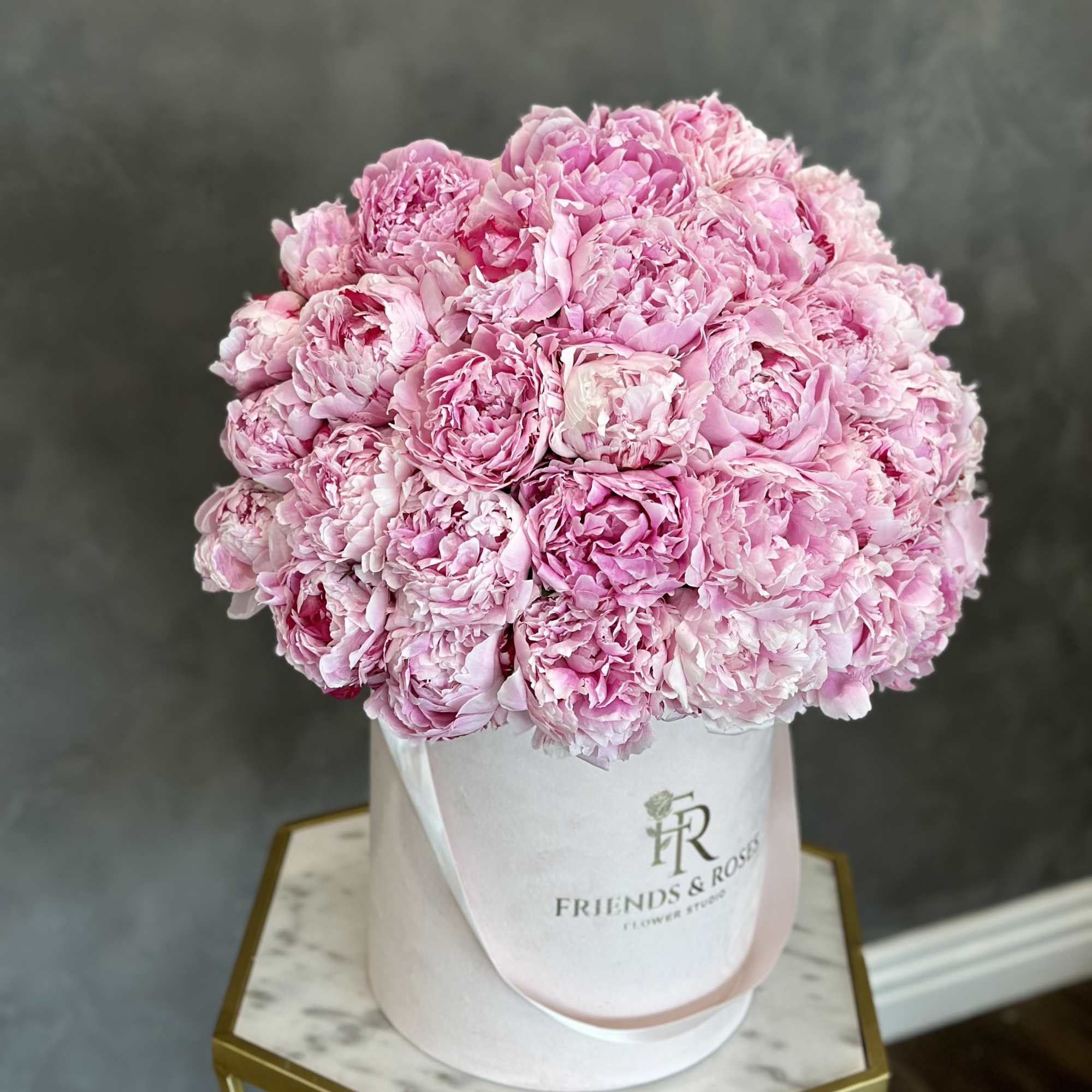 Pink peonies arranged in a white hat box, photo 2 of 2