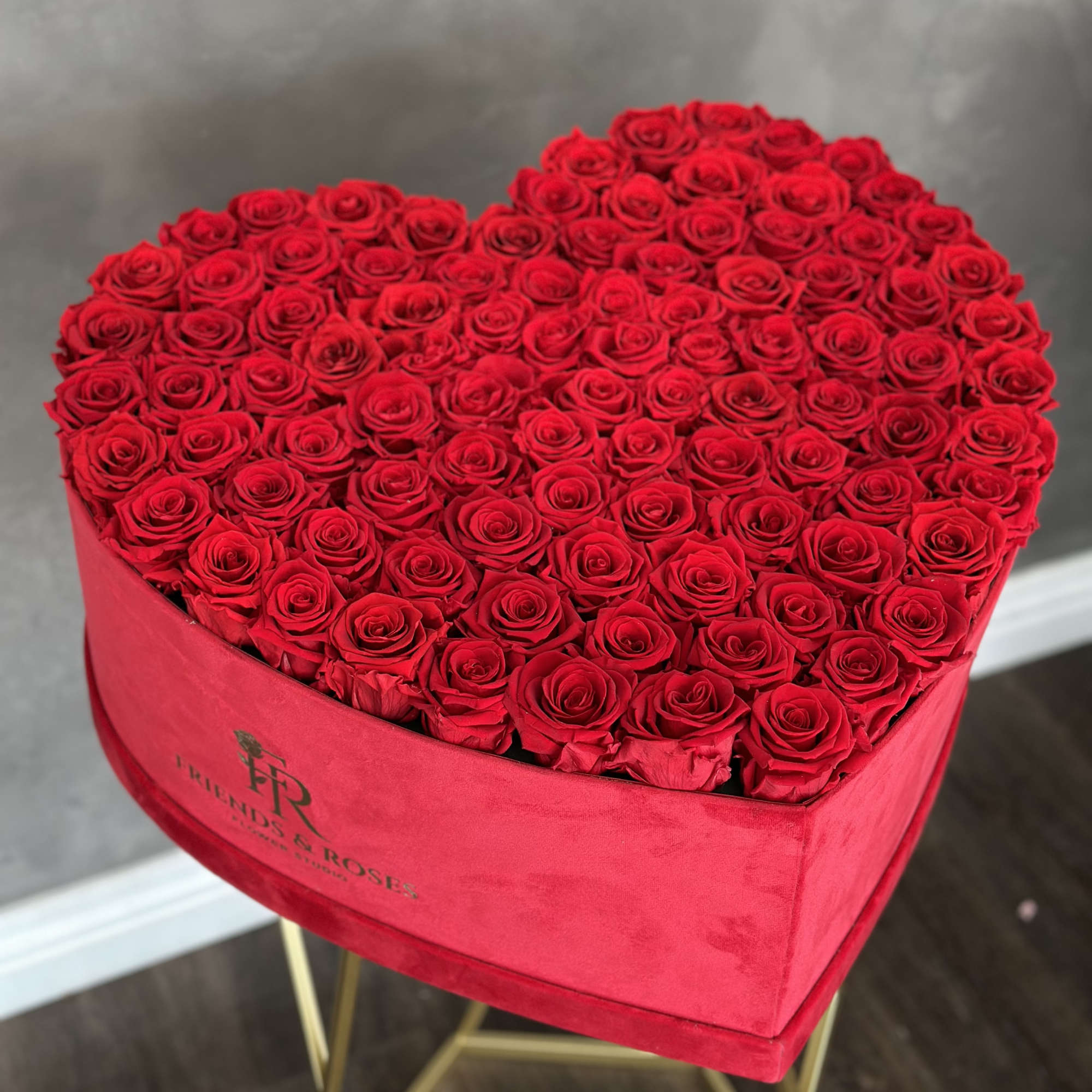 Heart-shaped box filled with red roses