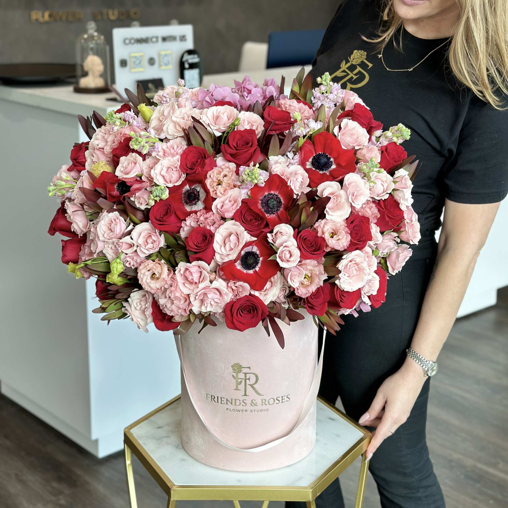 Large pink and red rose bouquet in a blush hatbox