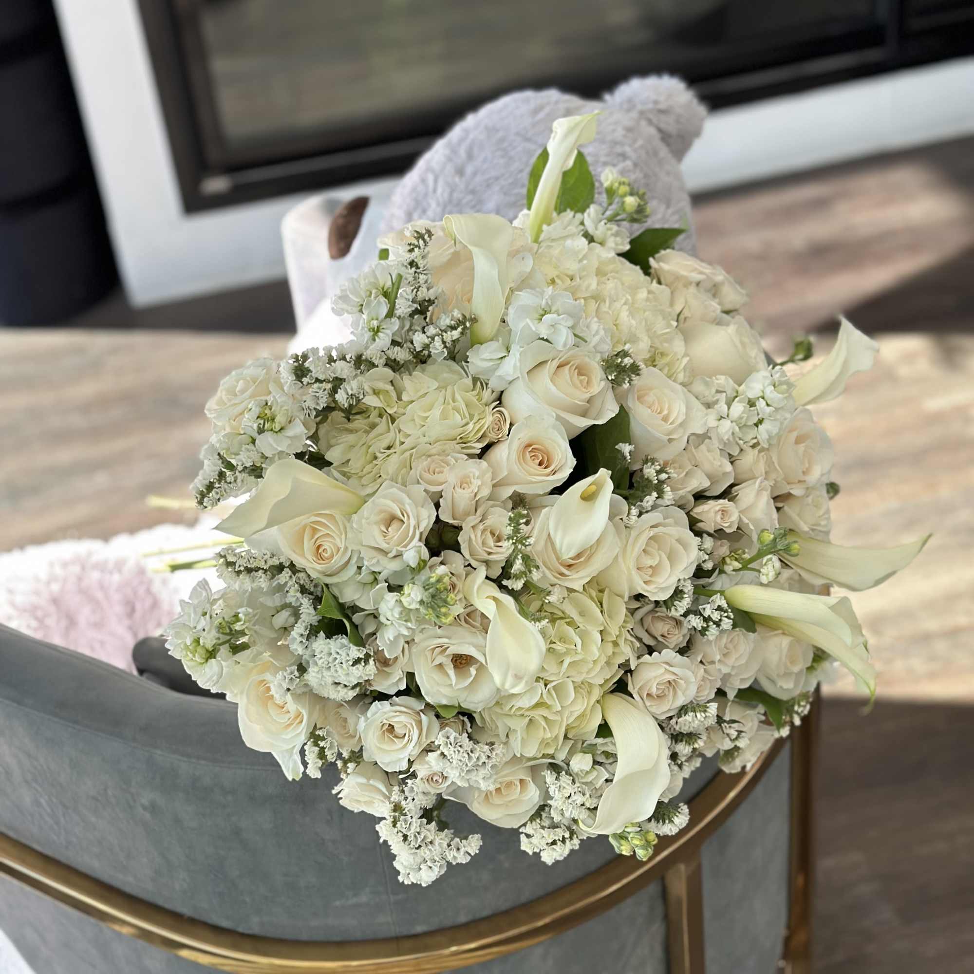Cream bouquet of roses, calla lilies, and hydrangeas