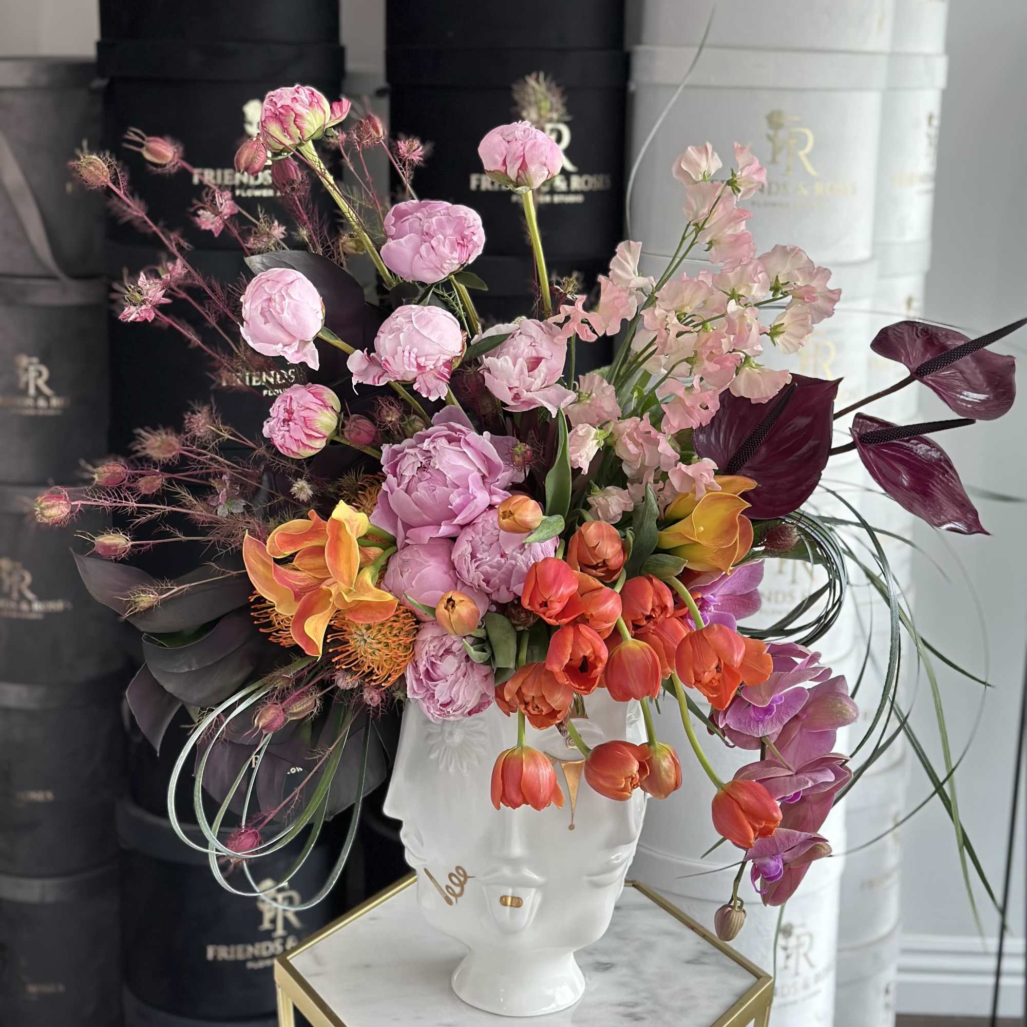 Colorful mixed bouquet in a white face vase