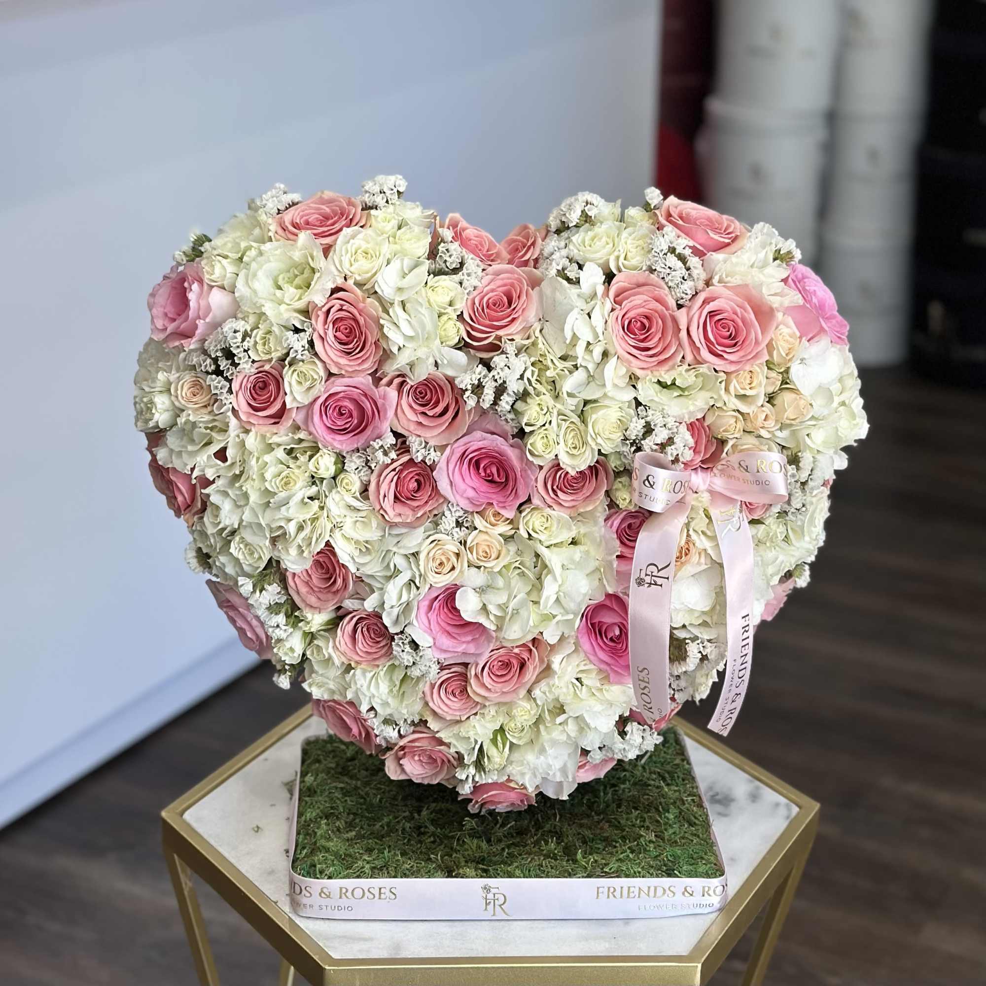 Heart-shaped arrangement of pink and white roses on a square base, photo 2 of 2
