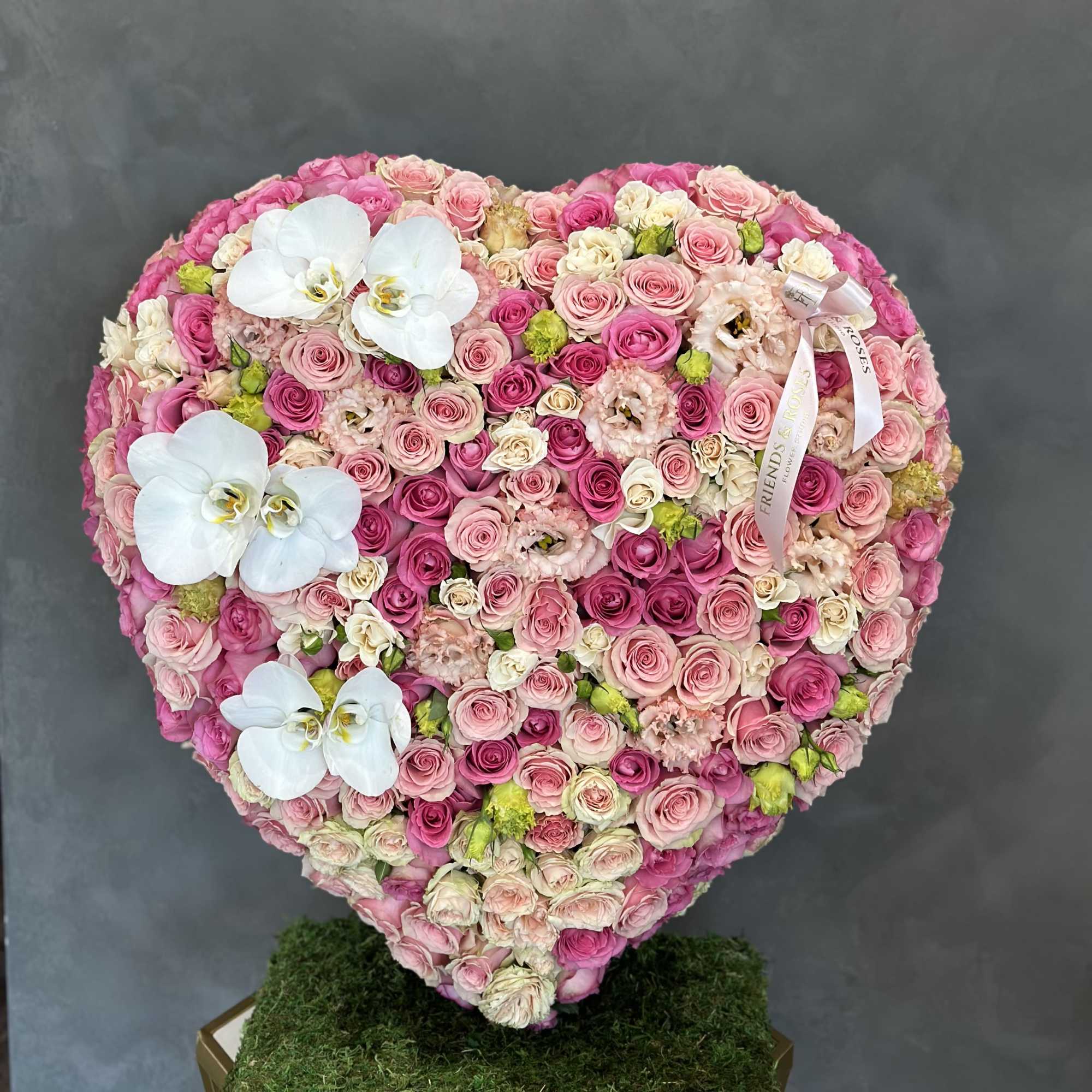 Heart-shaped pink rose arrangement with white orchids, photo 2 of 2