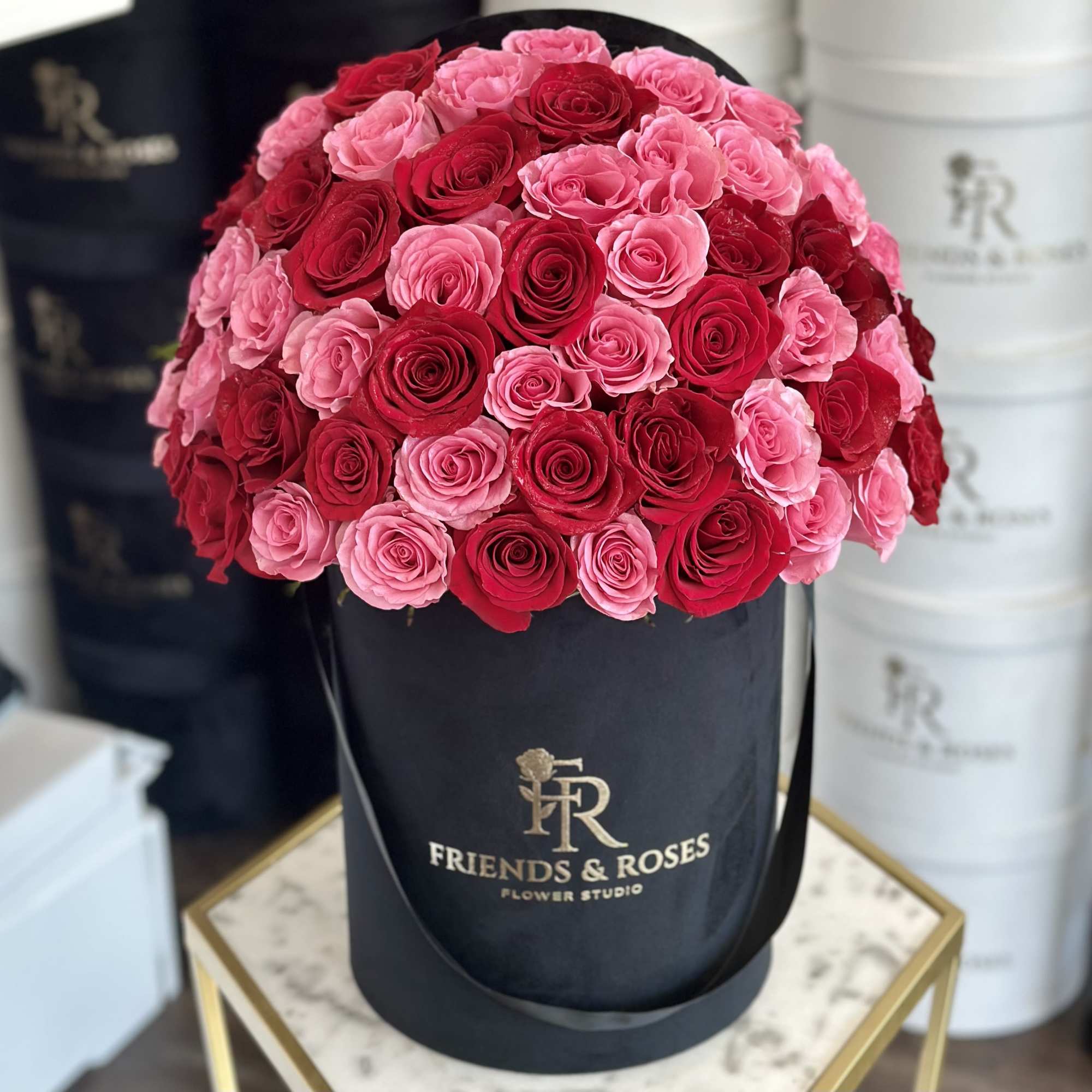 A beautiful arrangement of premium red and pink roses arranged in a, photo 2 of 3
