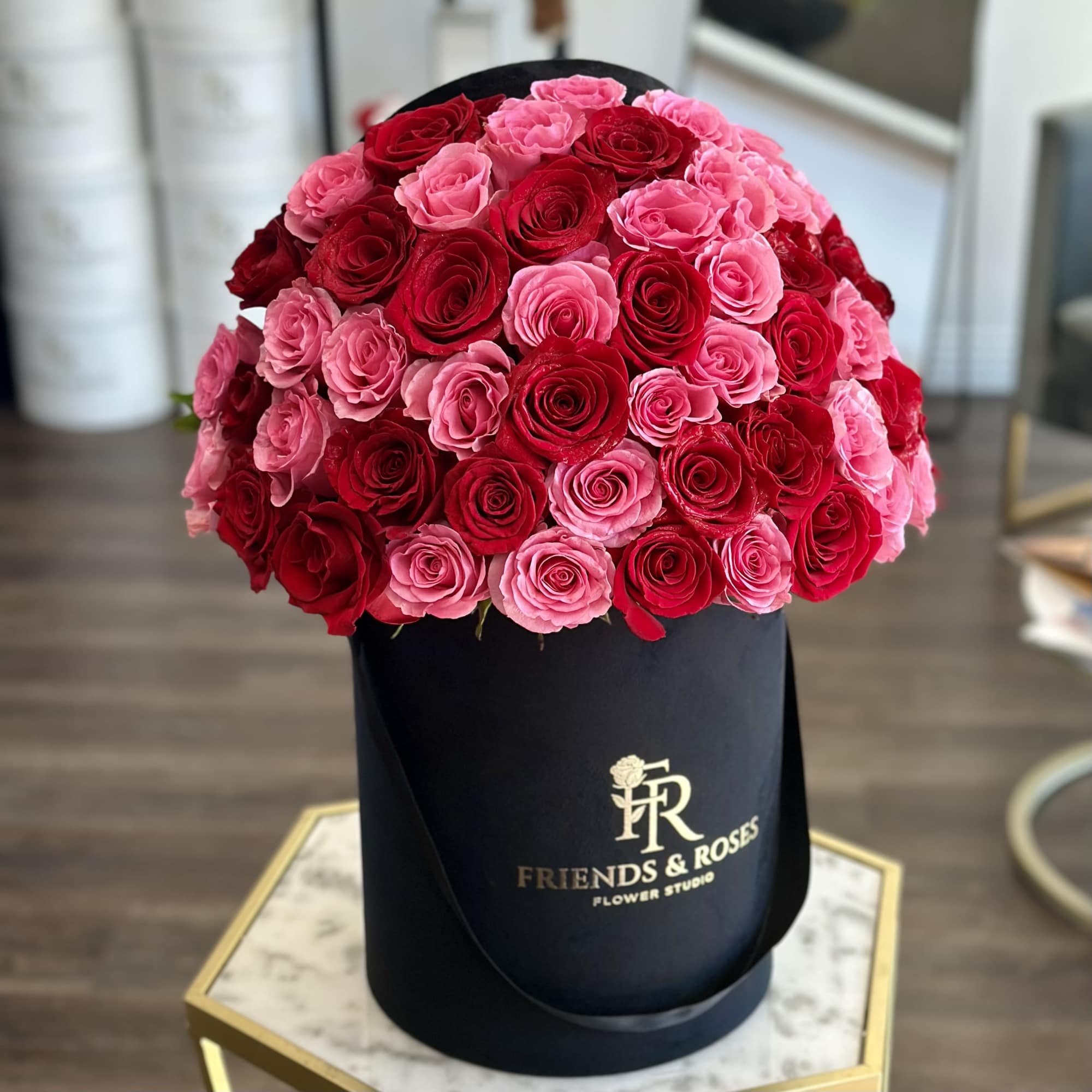 A beautiful arrangement of premium red and pink roses arranged in a, photo 3 of 3