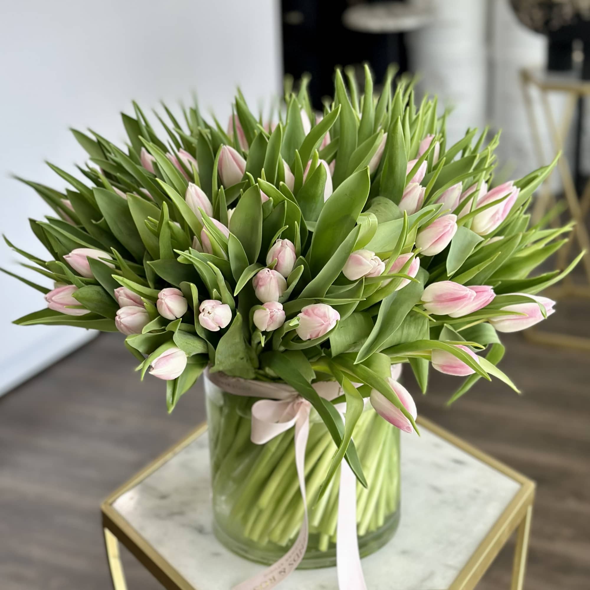 A breathtaking arrangement of 100 premium blush pink tulips designed in a, photo 2 of 4