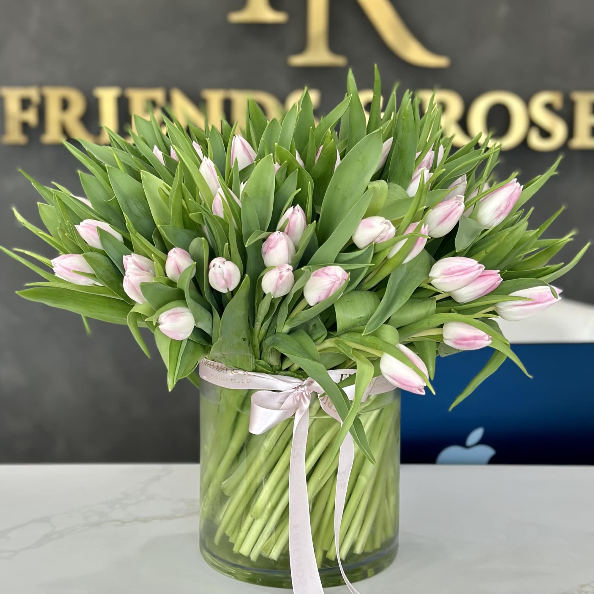 A breathtaking arrangement of 100 premium blush pink tulips designed in a, photo 3 of 4