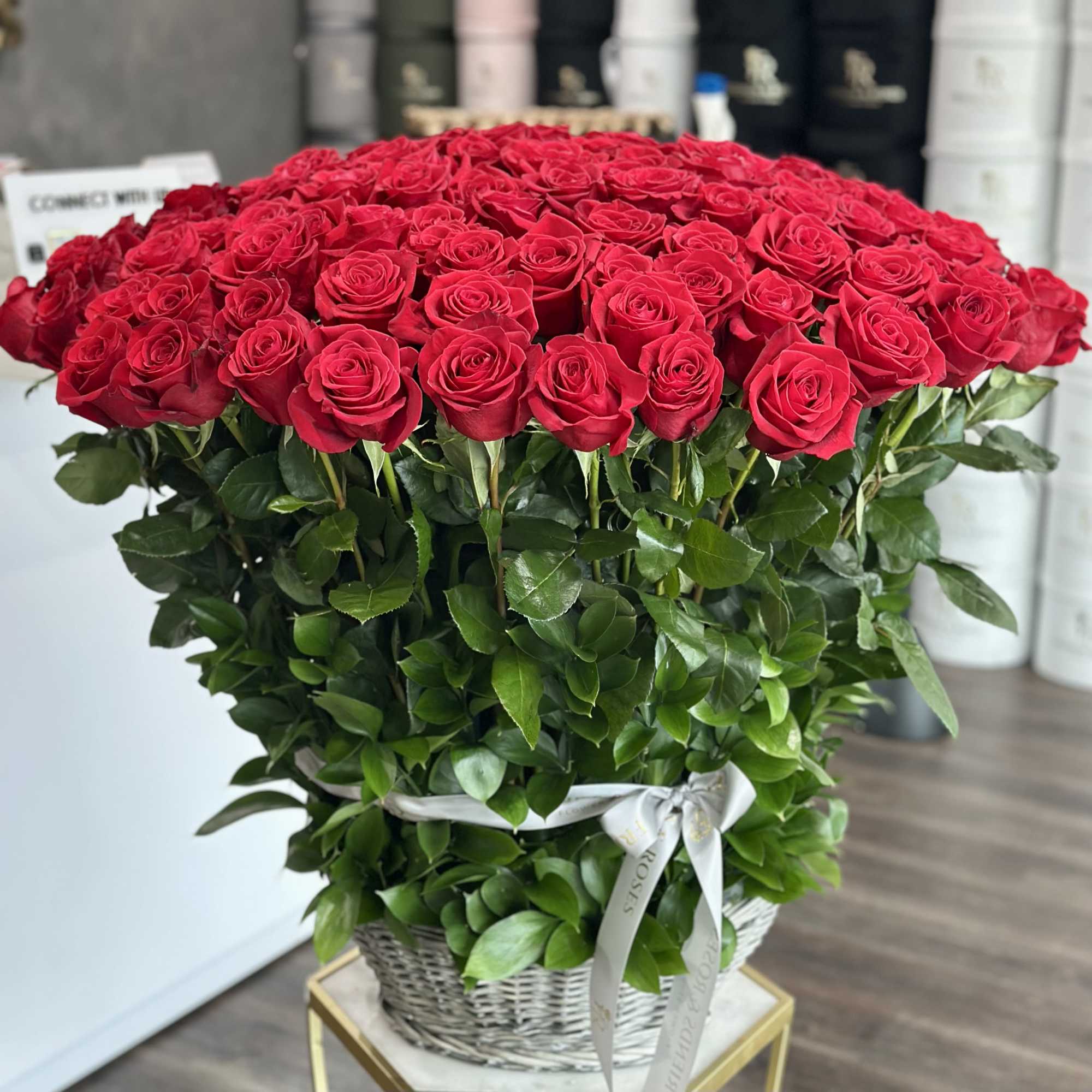 A big, beautiful bunch of 150 red roses packed into a charming
