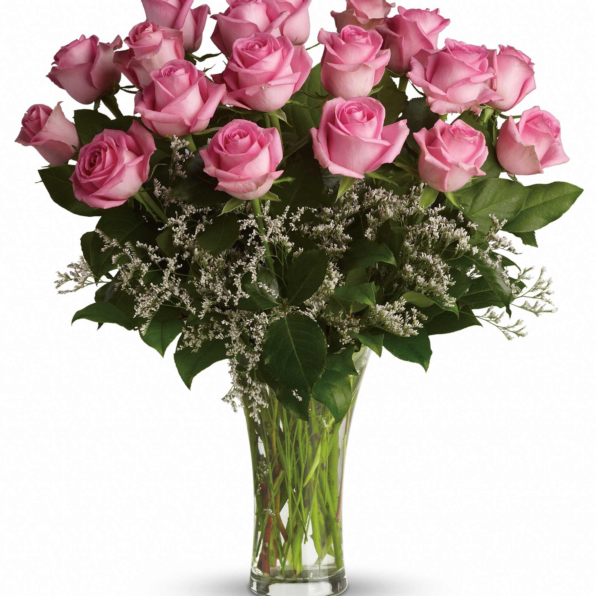 Pink roses arranged in a clear glass vase