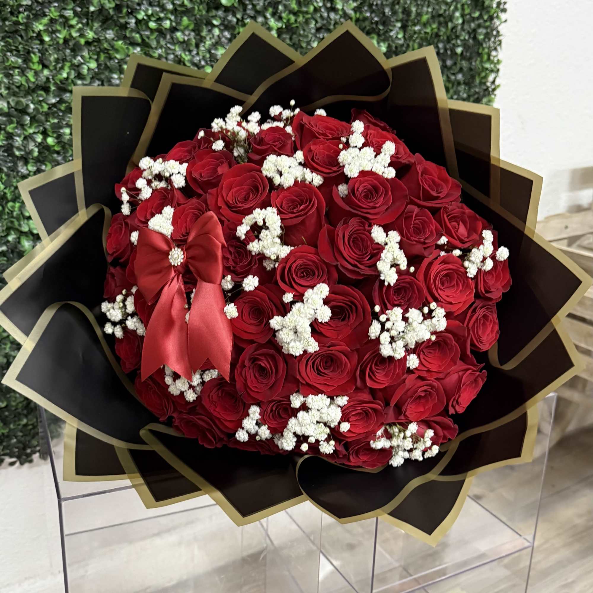 50 long stem Red roses with a touch of baby's breath, this