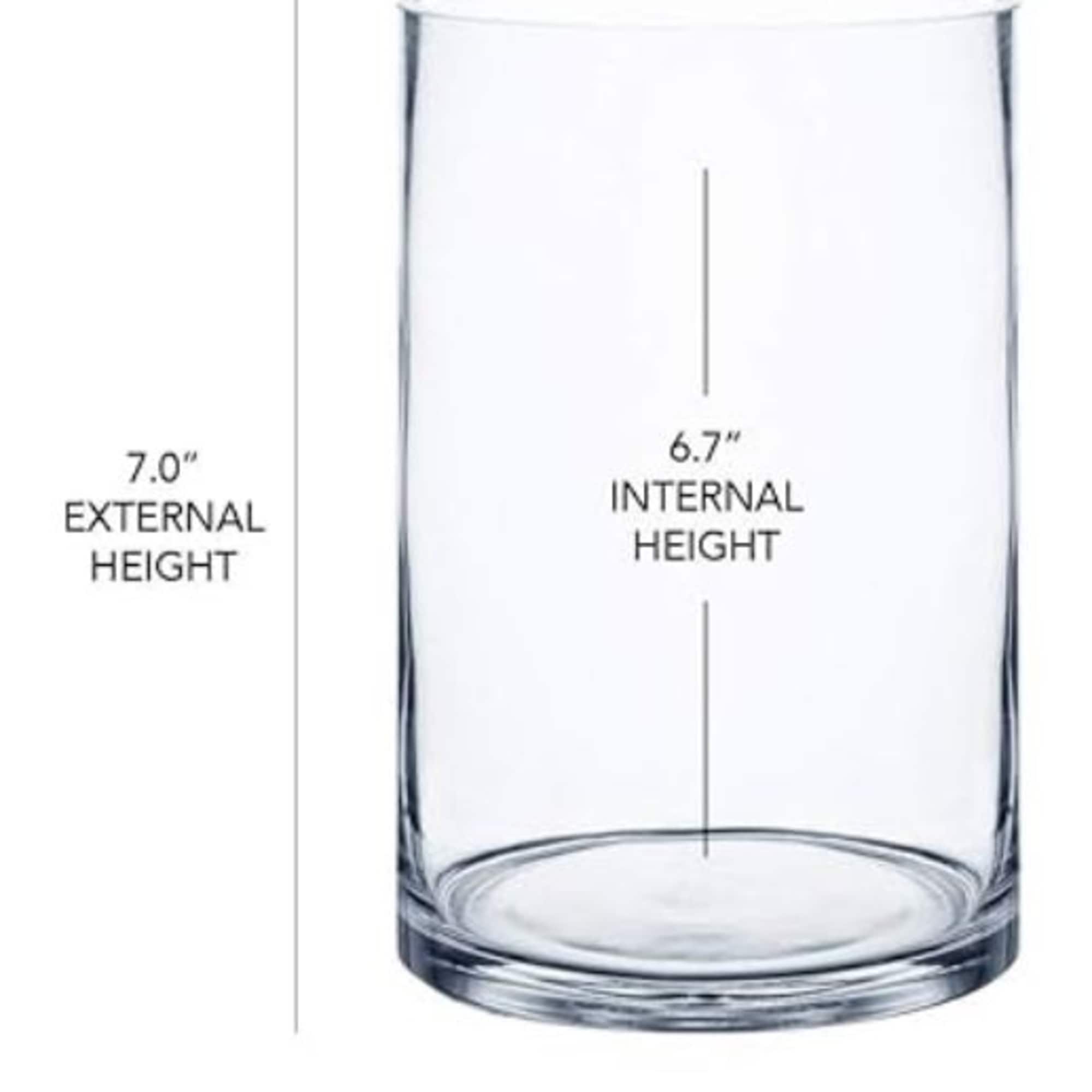 Clear glass cylinder vase with height measurements printed on it
