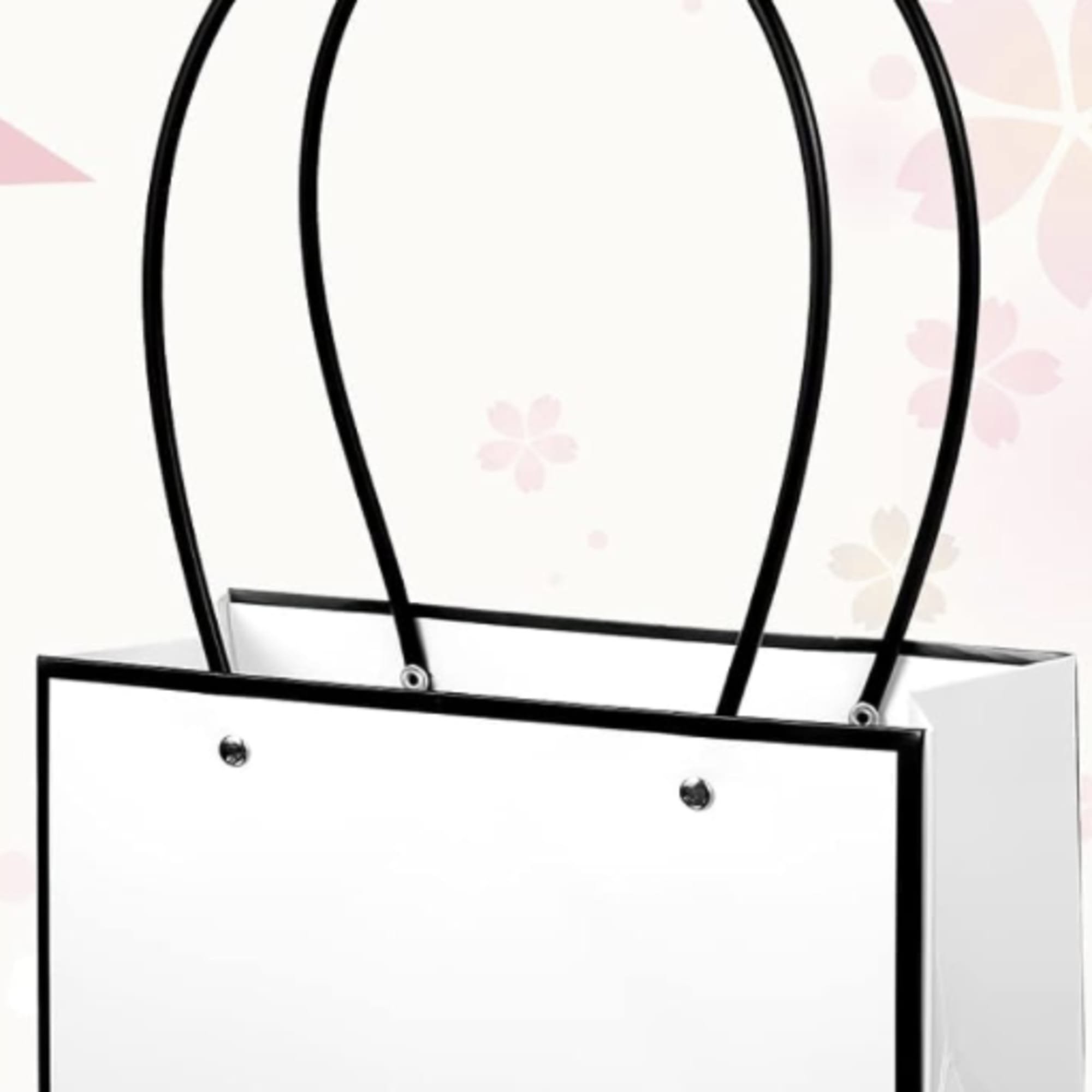 White gift bag with black handles and trim