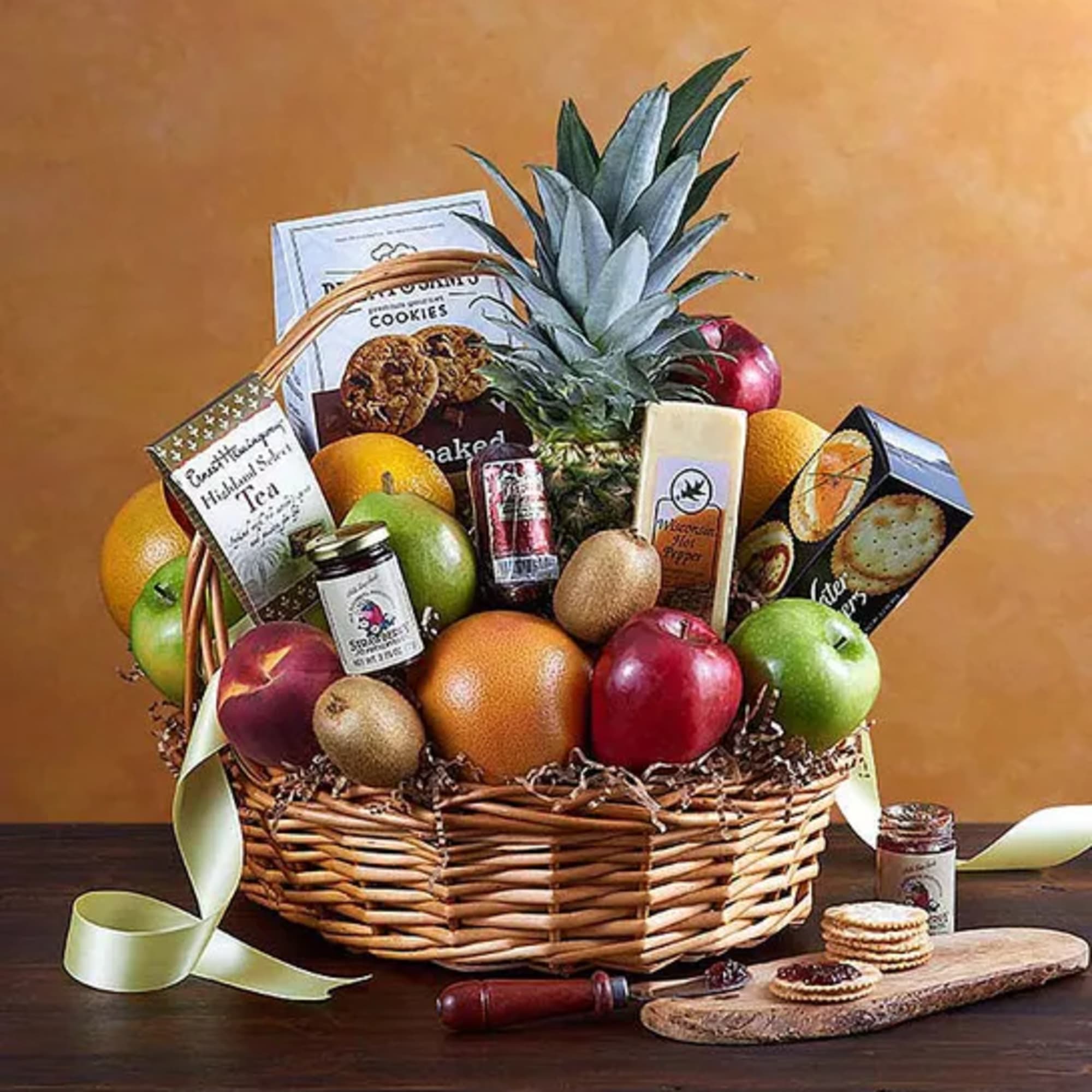 Fruit and snack gift basket with a pineapple and assorted fruit