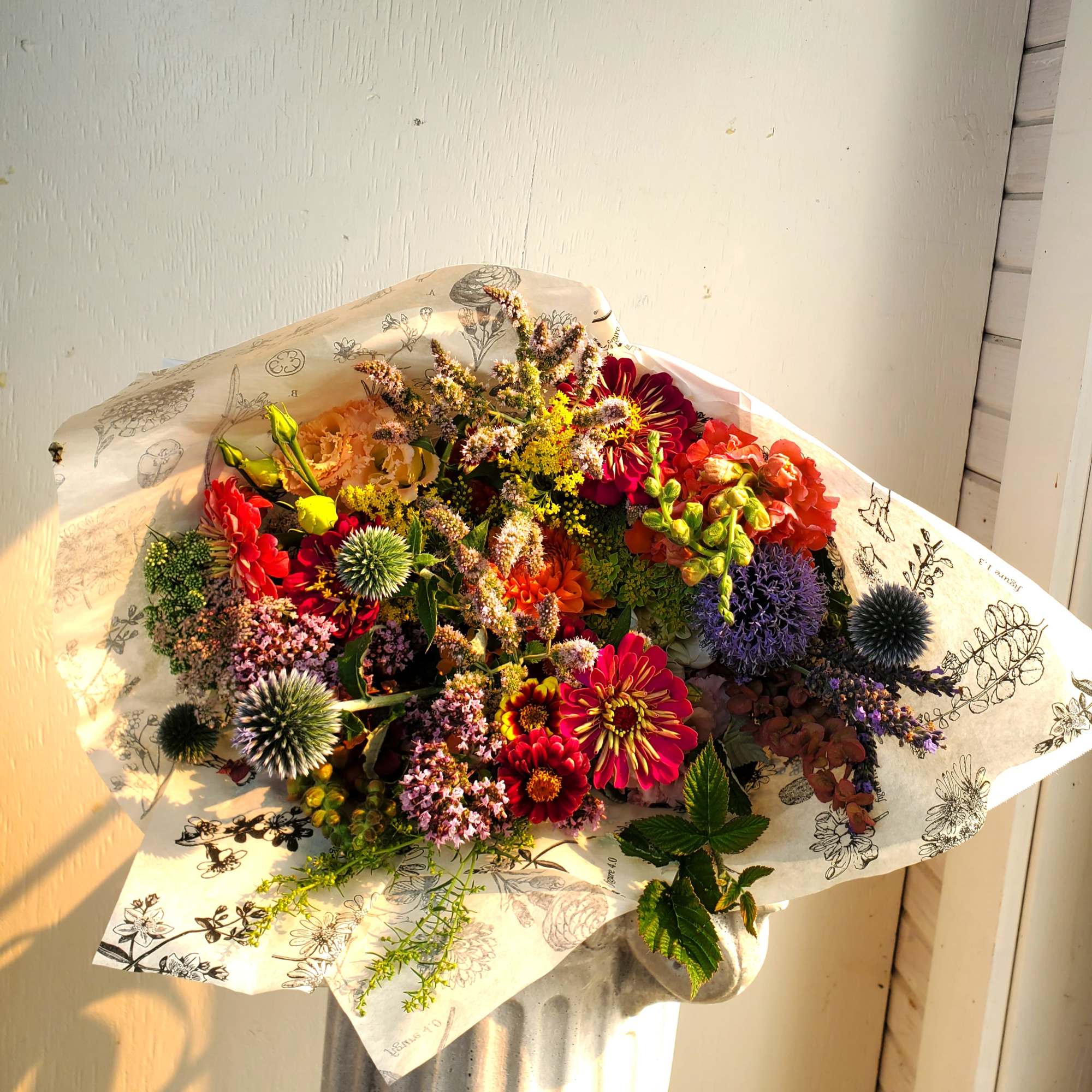 Colorful mixed bouquet wrapped in printed paper