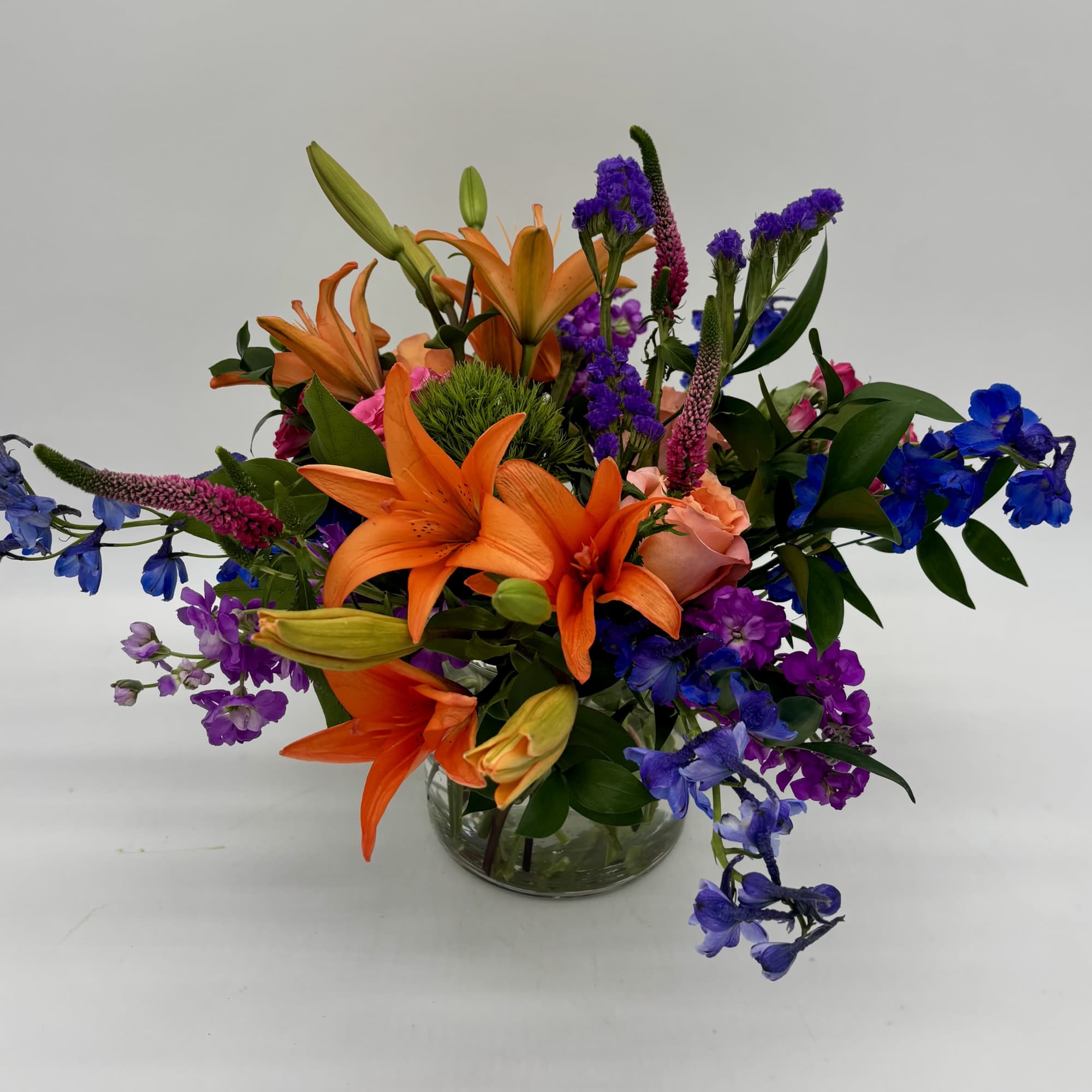 Bursting with exquisite colors and voluminous texture, the Breezy Meadows Bouquet brings