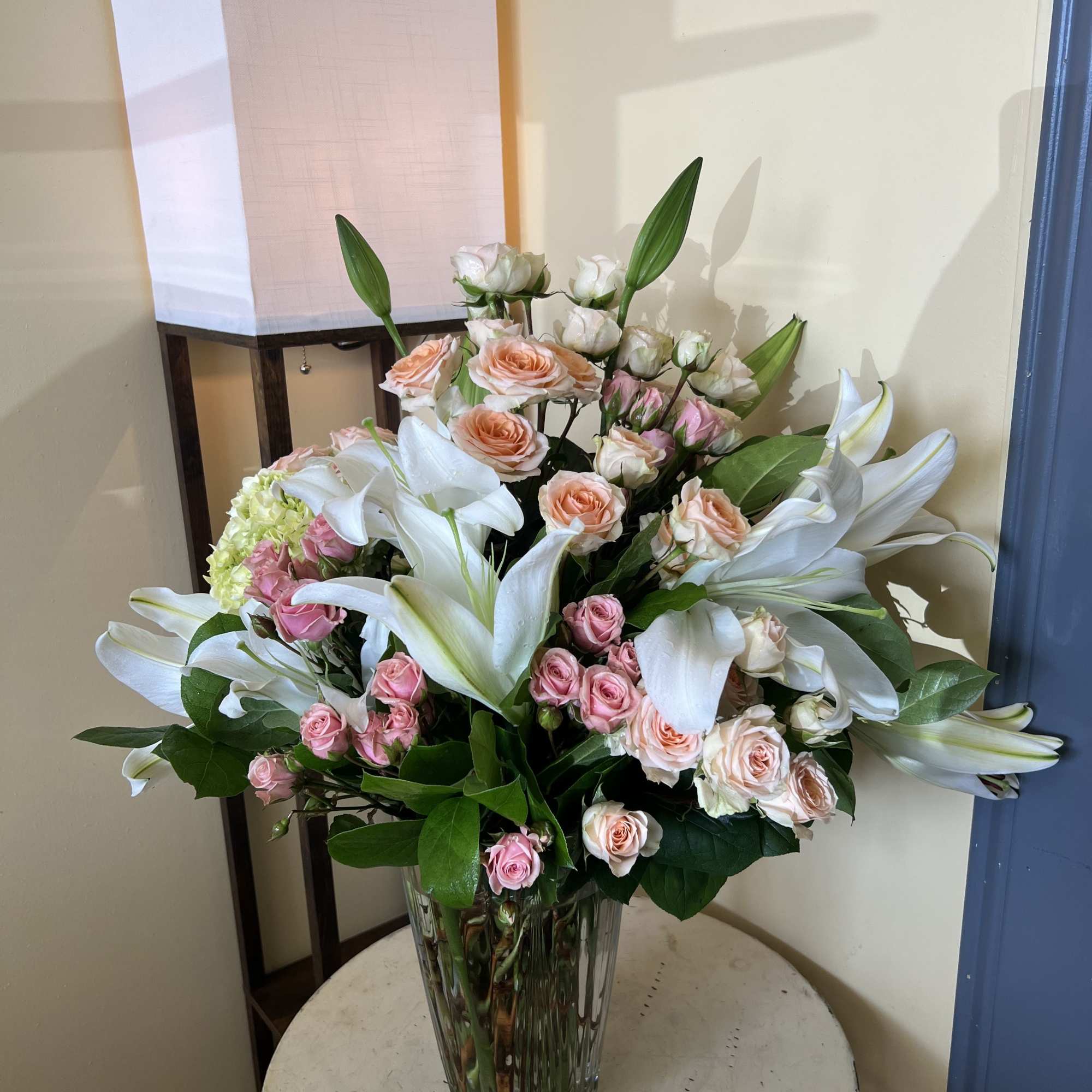 Beautiful oriental lilies. Desirable shades of pink spray roses. With exquisite hydrangeas.