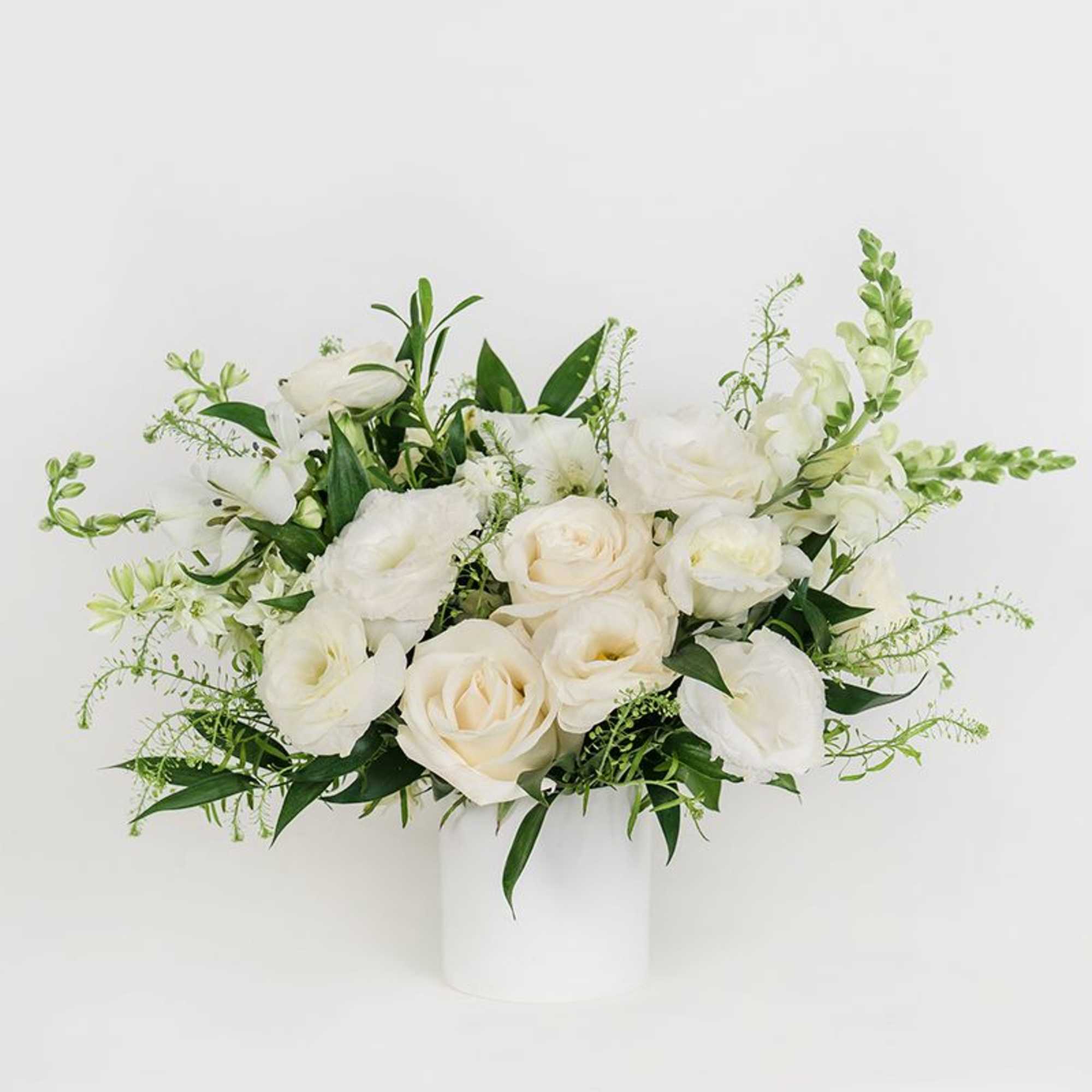 Our Petite Seasonal Arrangement features pretty neutral seasonal blooms, making it the