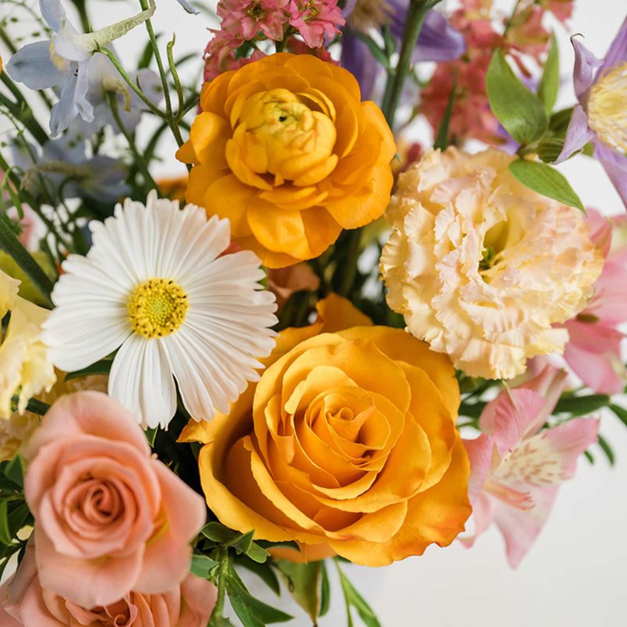 A fresh and modern arrangement with seasonal blooms and foliage, each one, photo 2 of 3