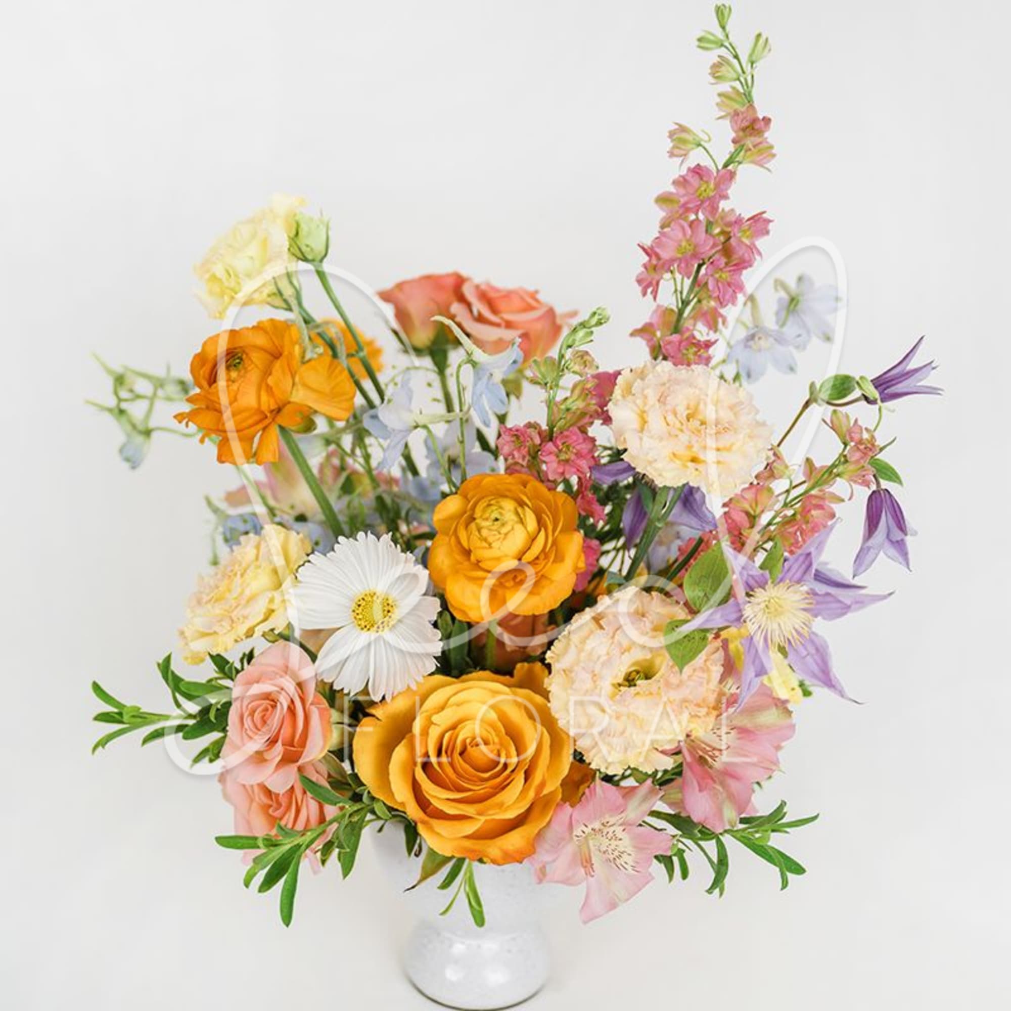 A fresh and modern arrangement with seasonal blooms and foliage, each one, photo 3 of 3