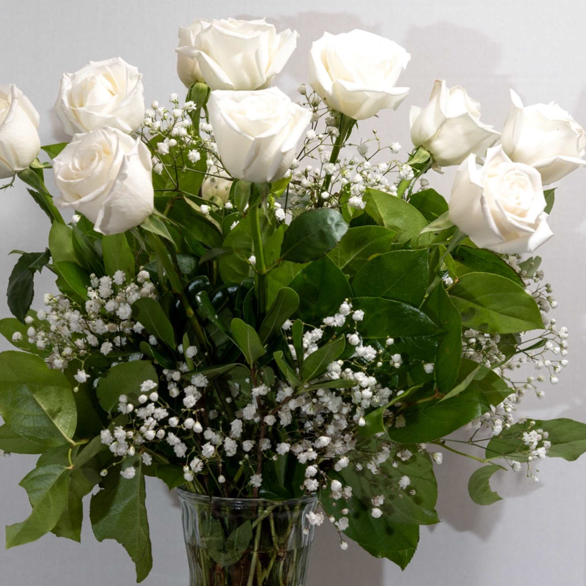 A graceful bouquet of white roses, framed by baby's-breath filler. The sophisticated, photo 2 of 2