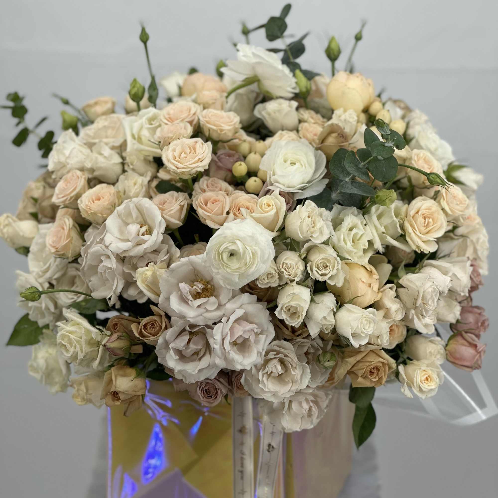 Large bouquet of cream and blush roses in a gift box