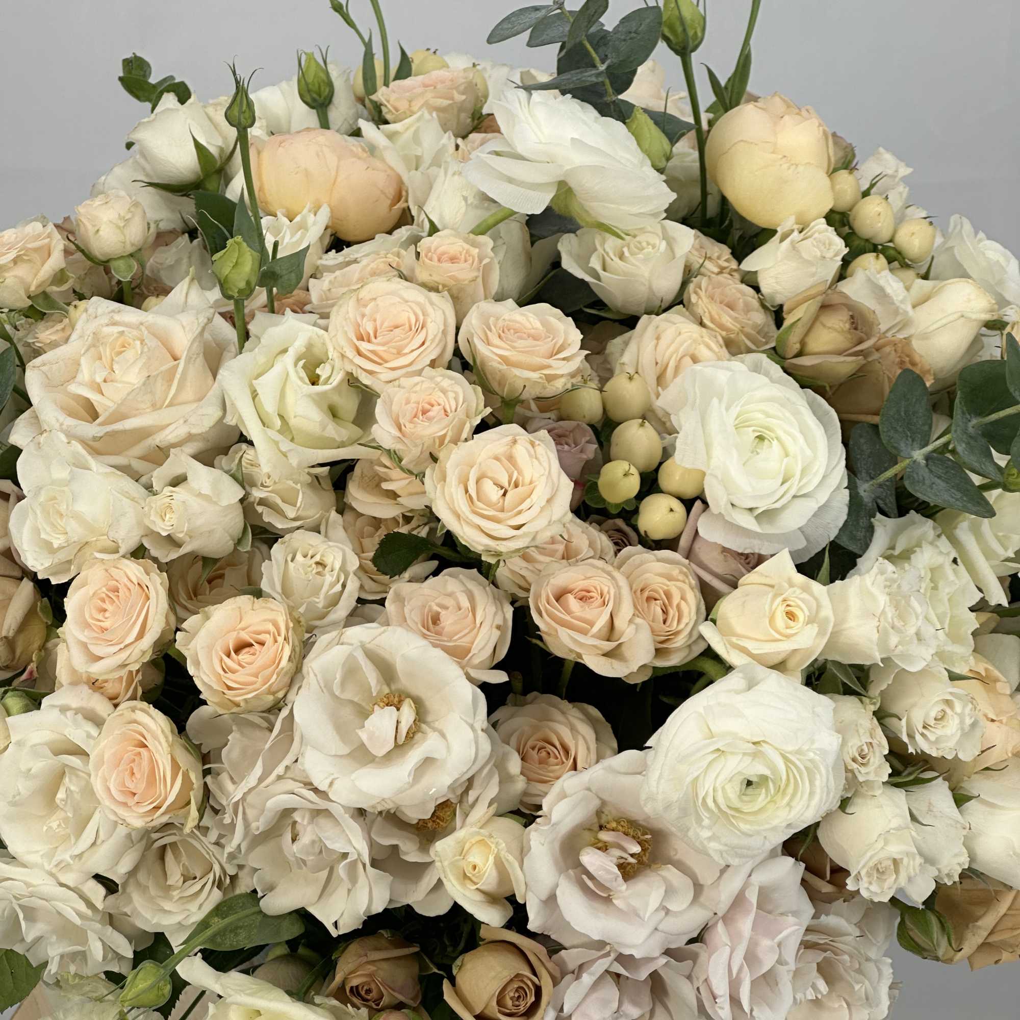 Large bouquet of cream and blush roses with white blooms
