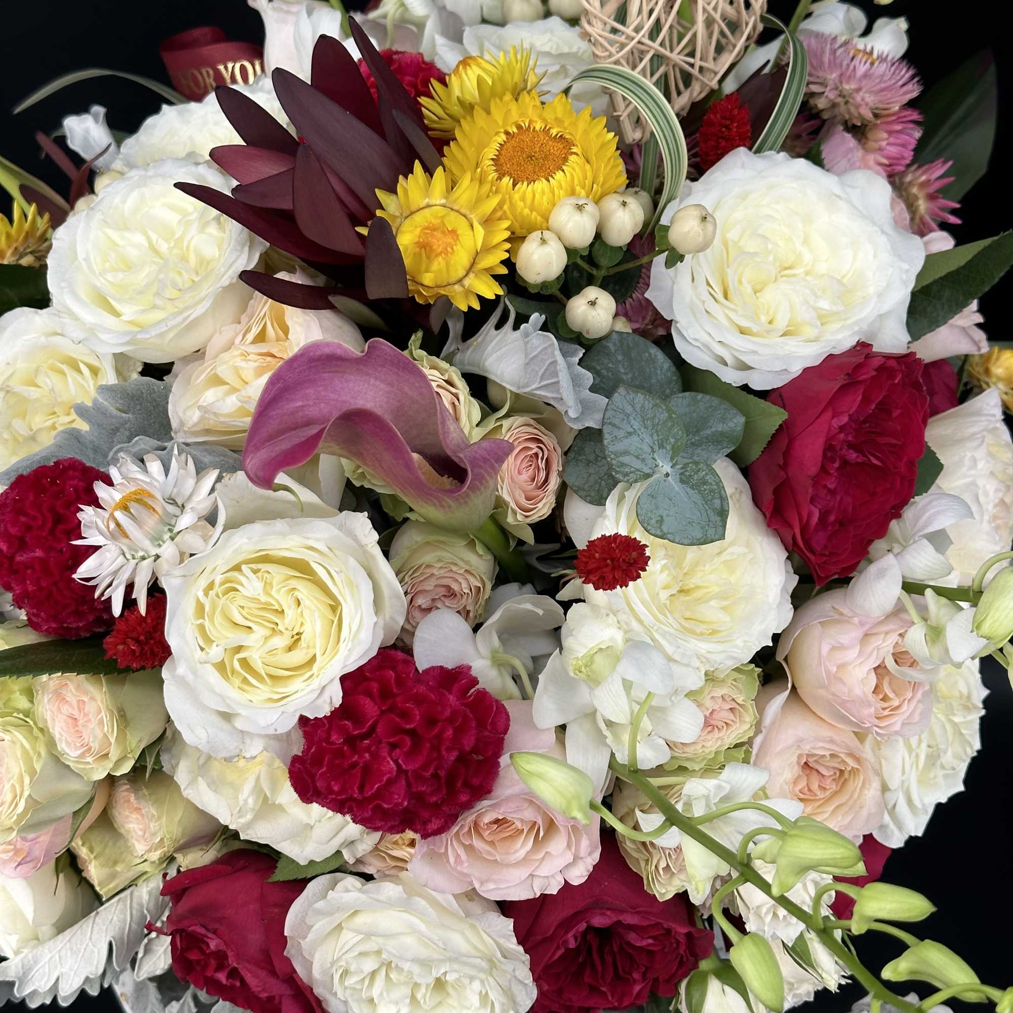 Mixed bouquet of white, pink, red, and yellow flowers